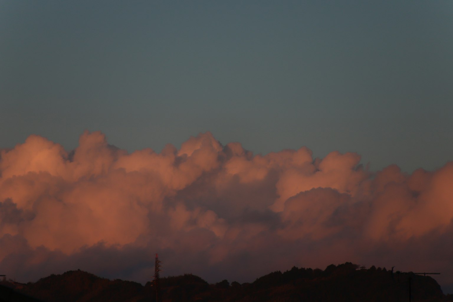 Sunset clouds with mountain silhouette