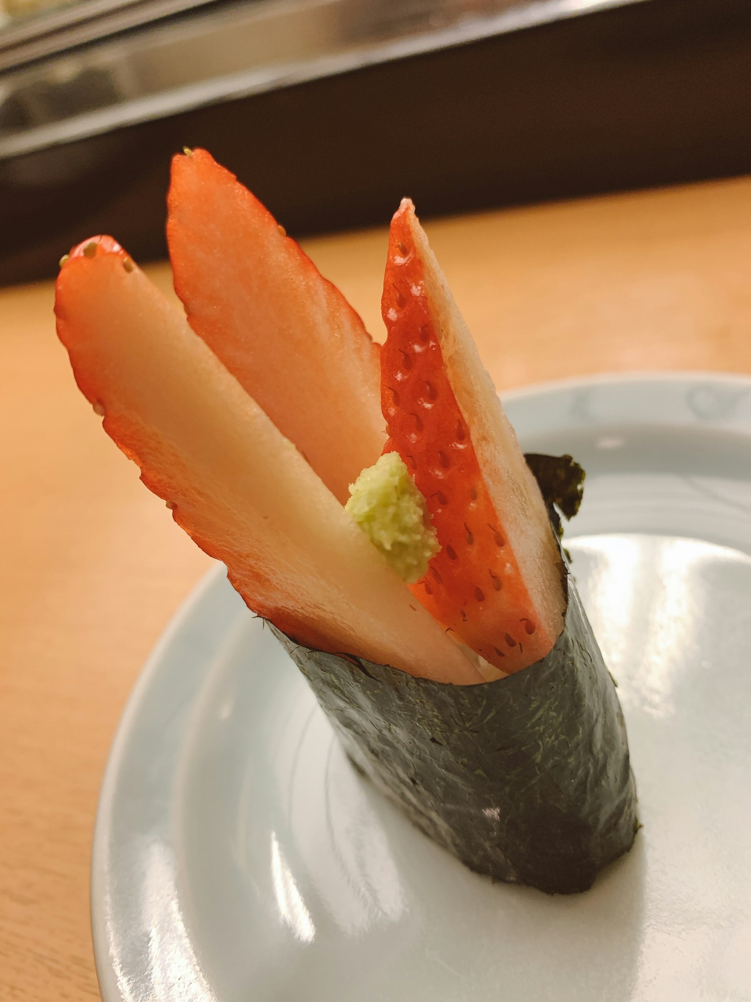 Sushi made with strawberries wrapped in seaweed showcasing fresh fruit