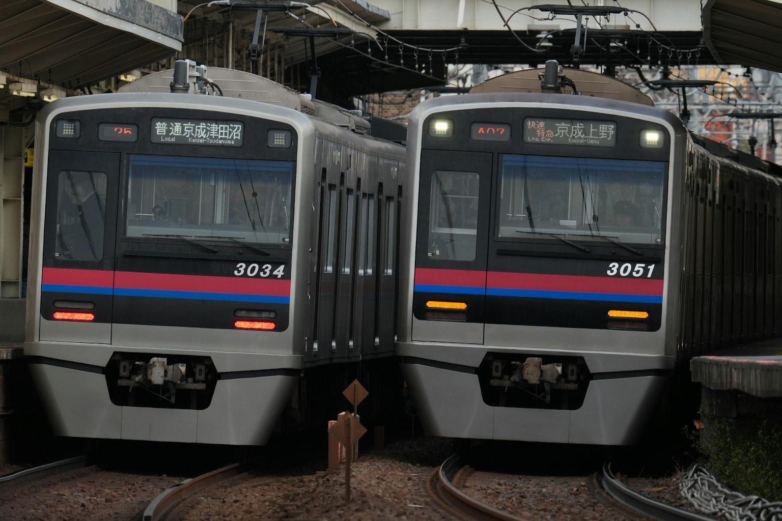 Two trains crossing at a station