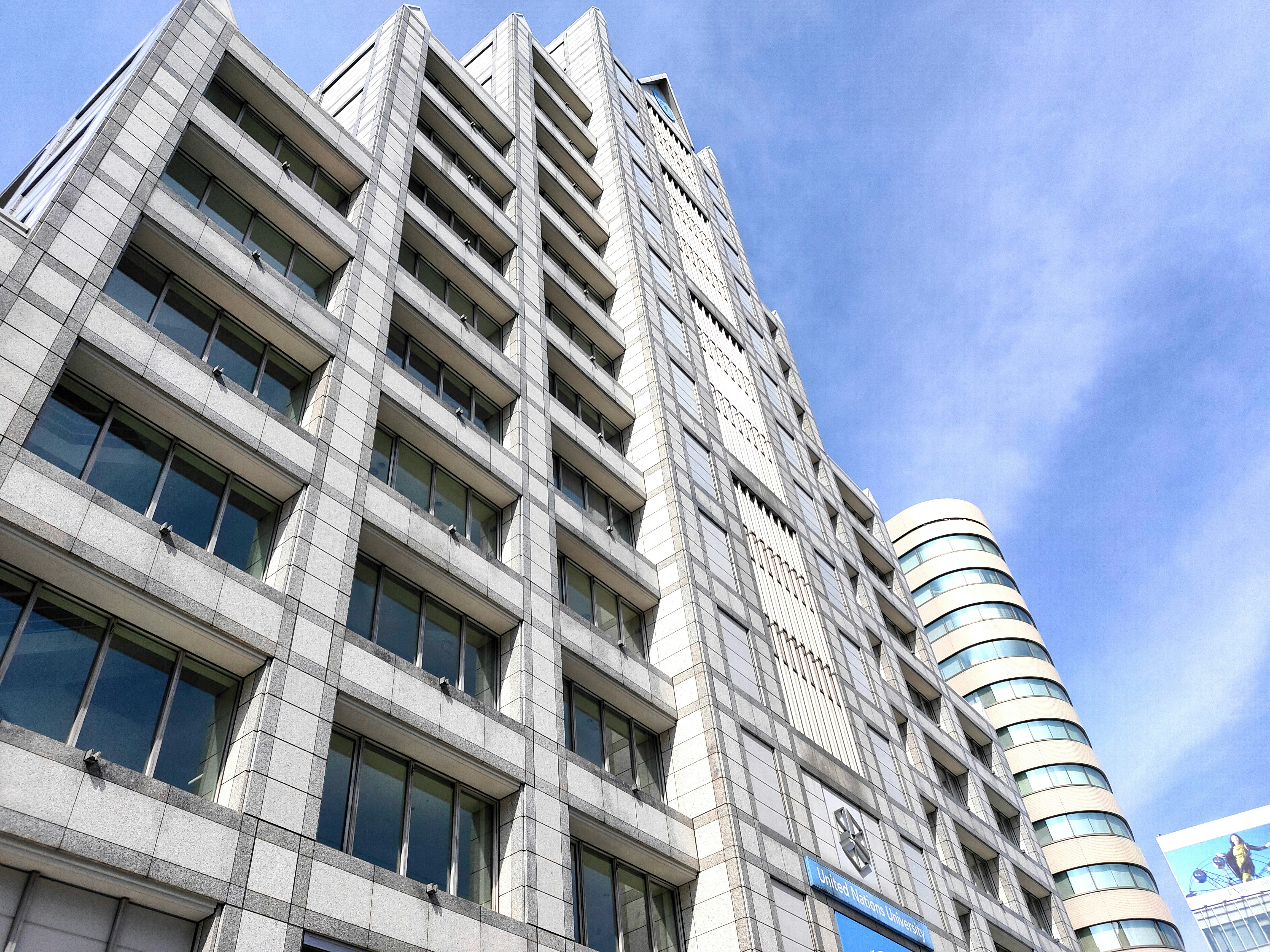 exterior of tall office buildings with glass facade