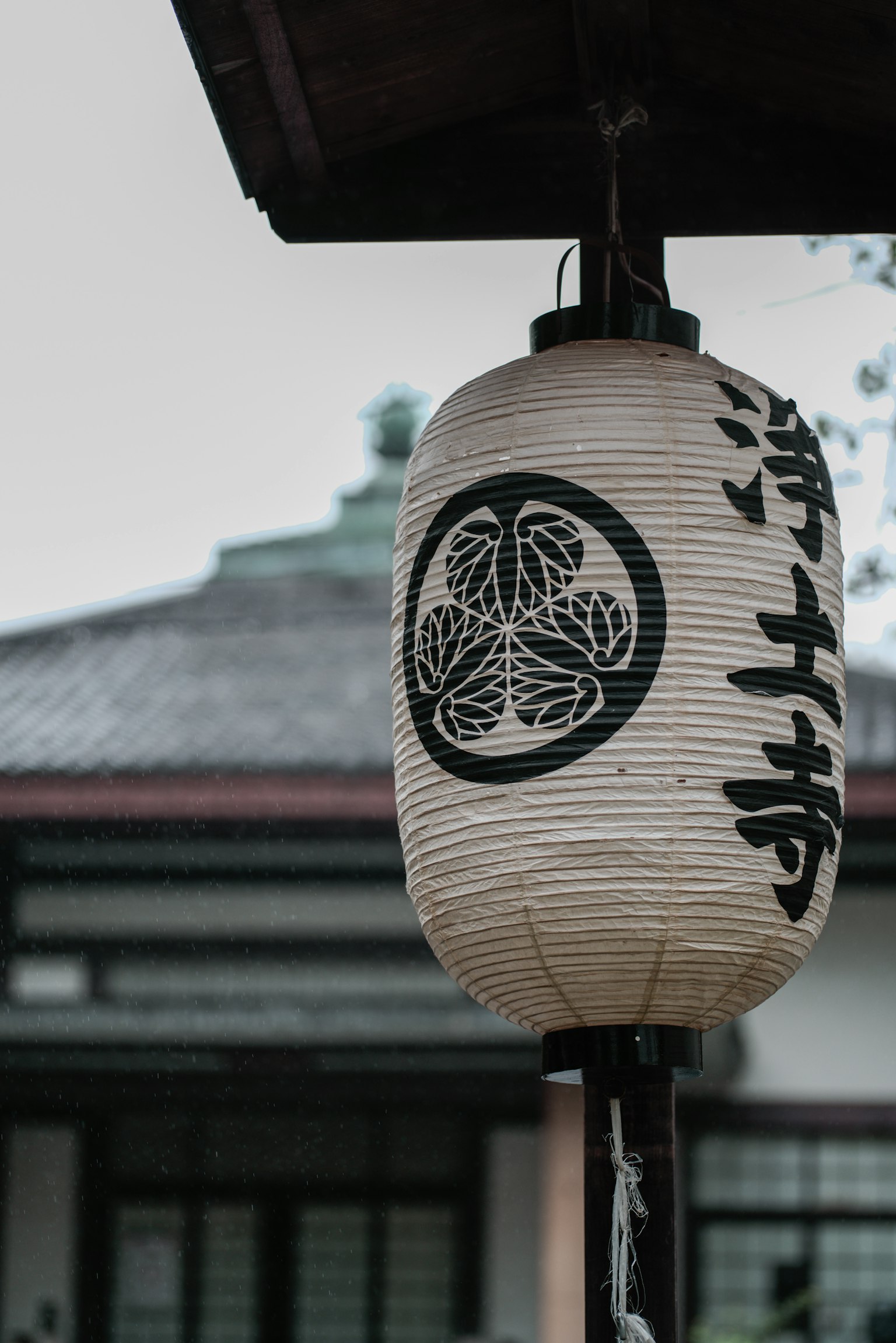 Traditional Japanese lantern hanging in an outdoor setting