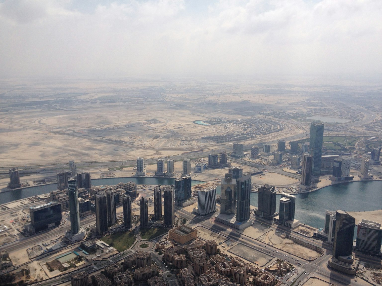 Aerial view of Dubai's skyscrapers and expansive desert landscape