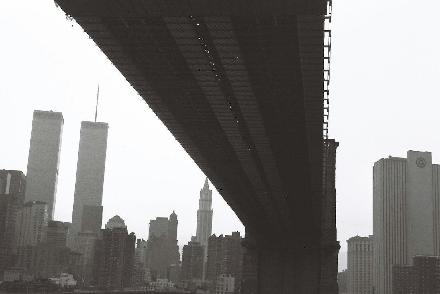 View of New York City skyline and Twin Towers from under the Manhattan Bridge