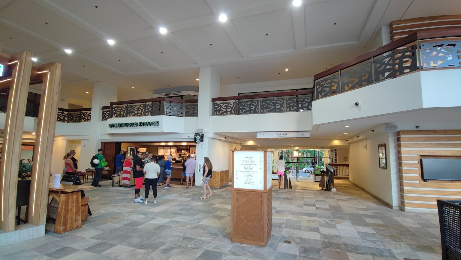 Spacious lobby with bright lighting and people gathered