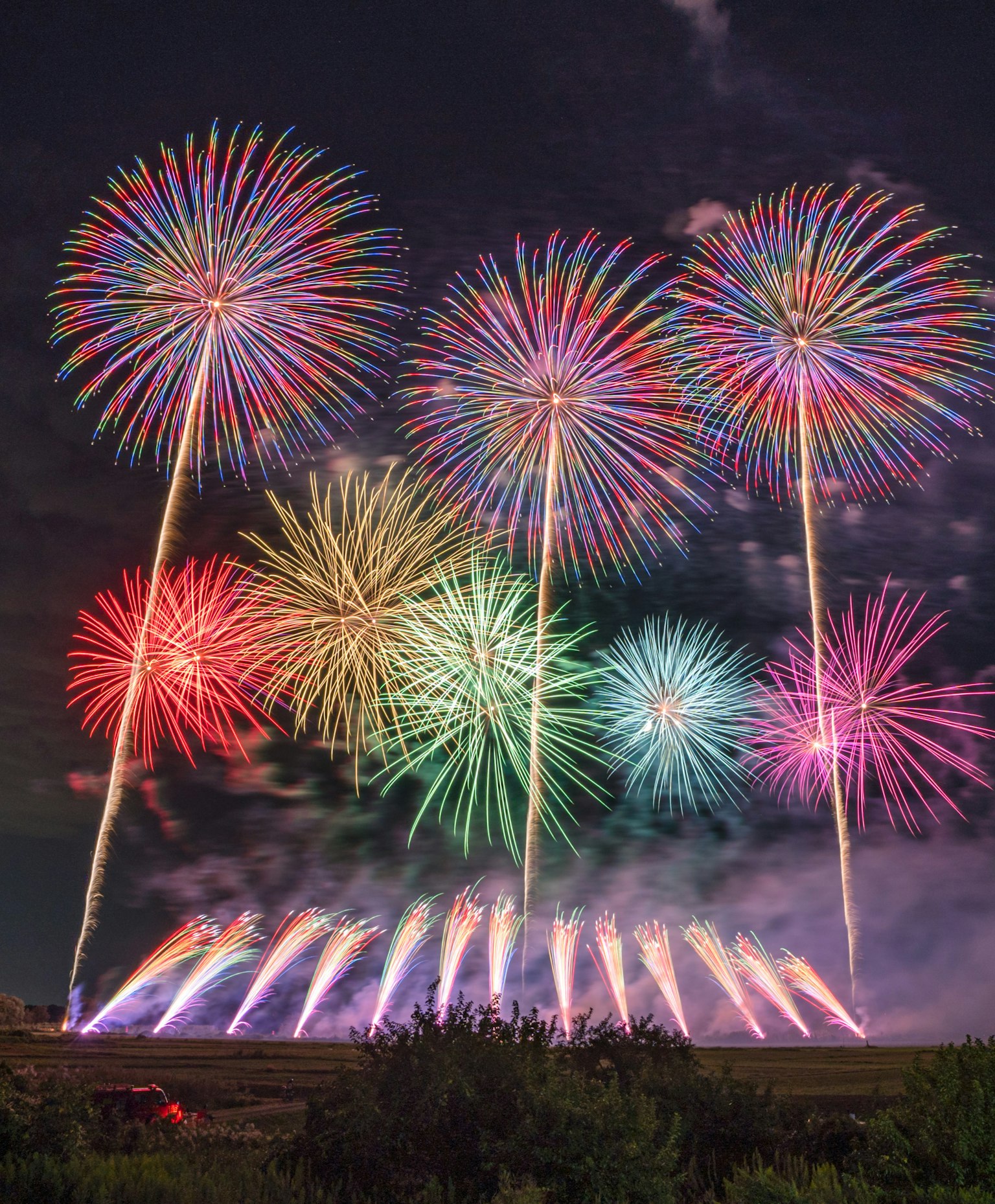 Colorful fireworks beautifully burst in the night sky
