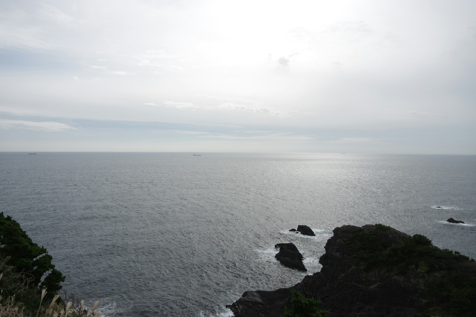A scenic view of the ocean and rocky coastline