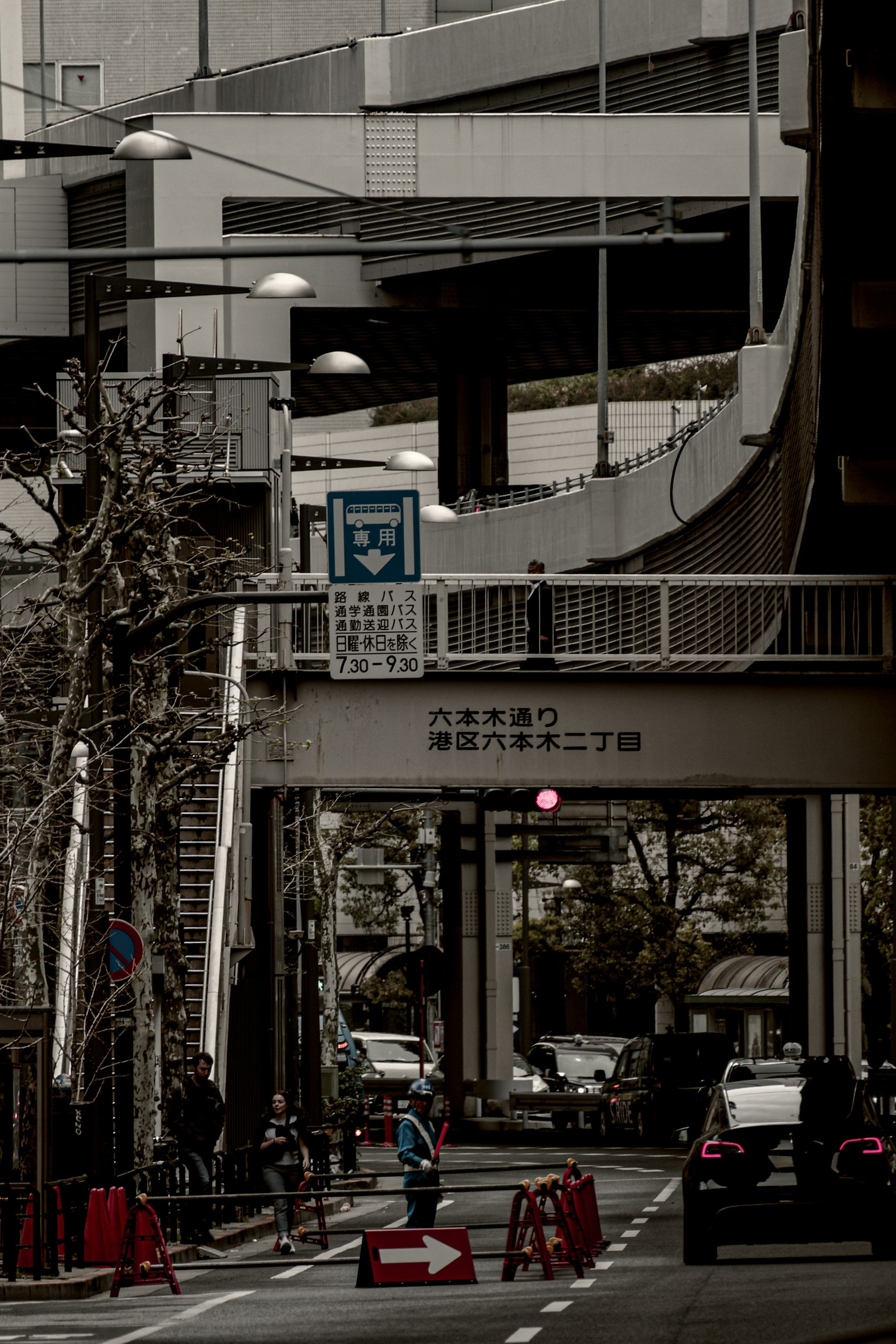 Urban intersection featuring an overpass and traffic signals