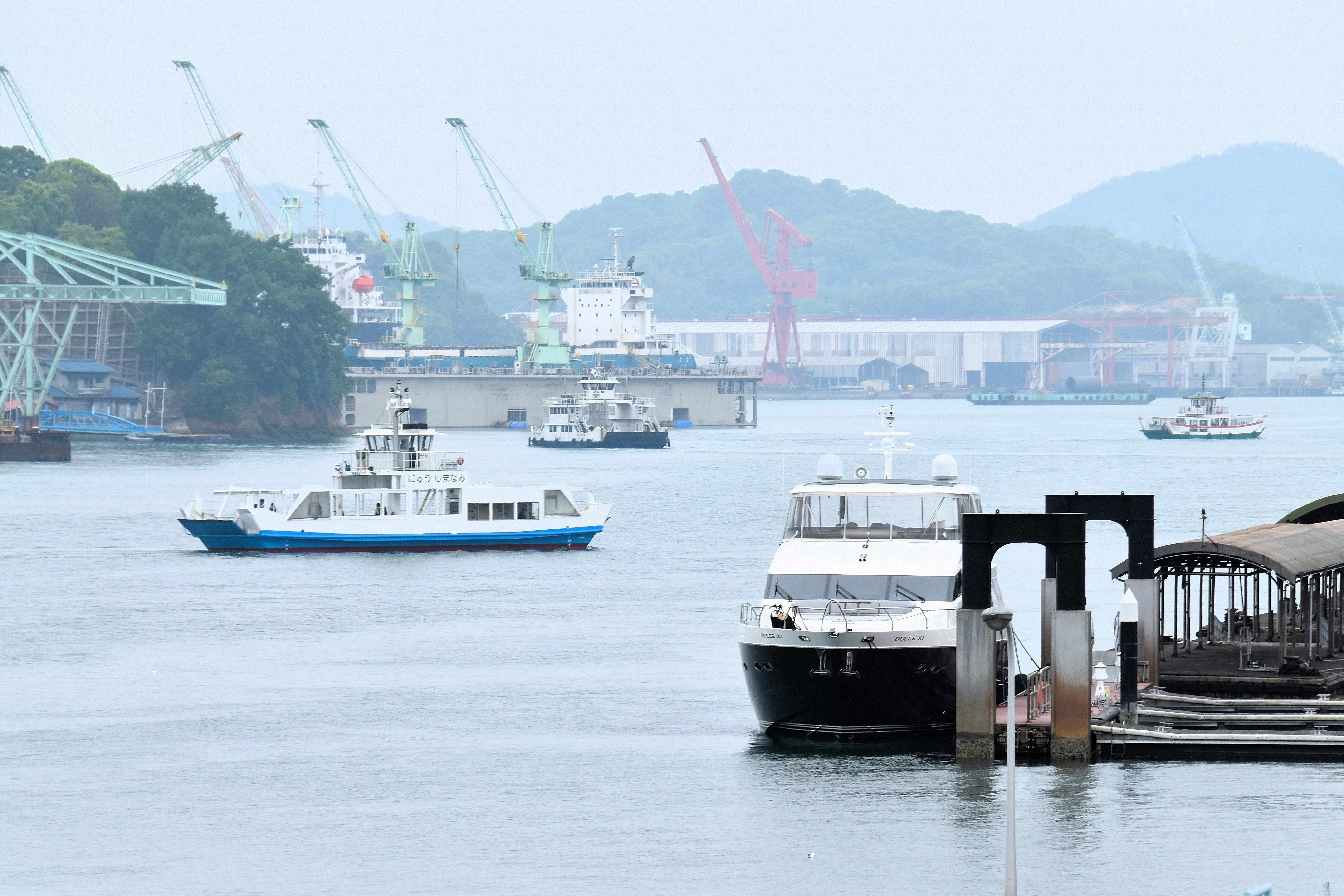 harbor scene with moored ships and a floating dock