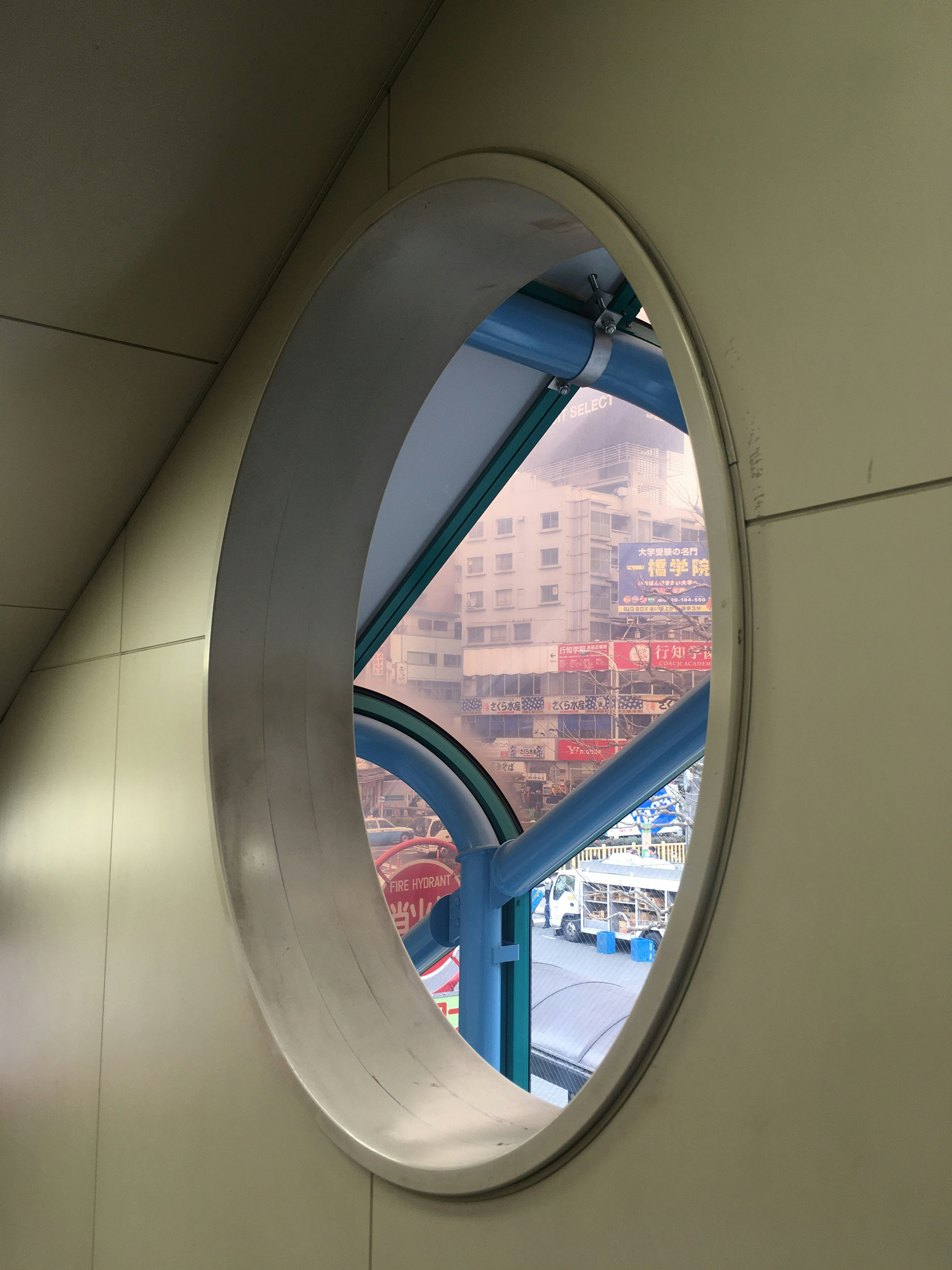city view through an oval tunnel window