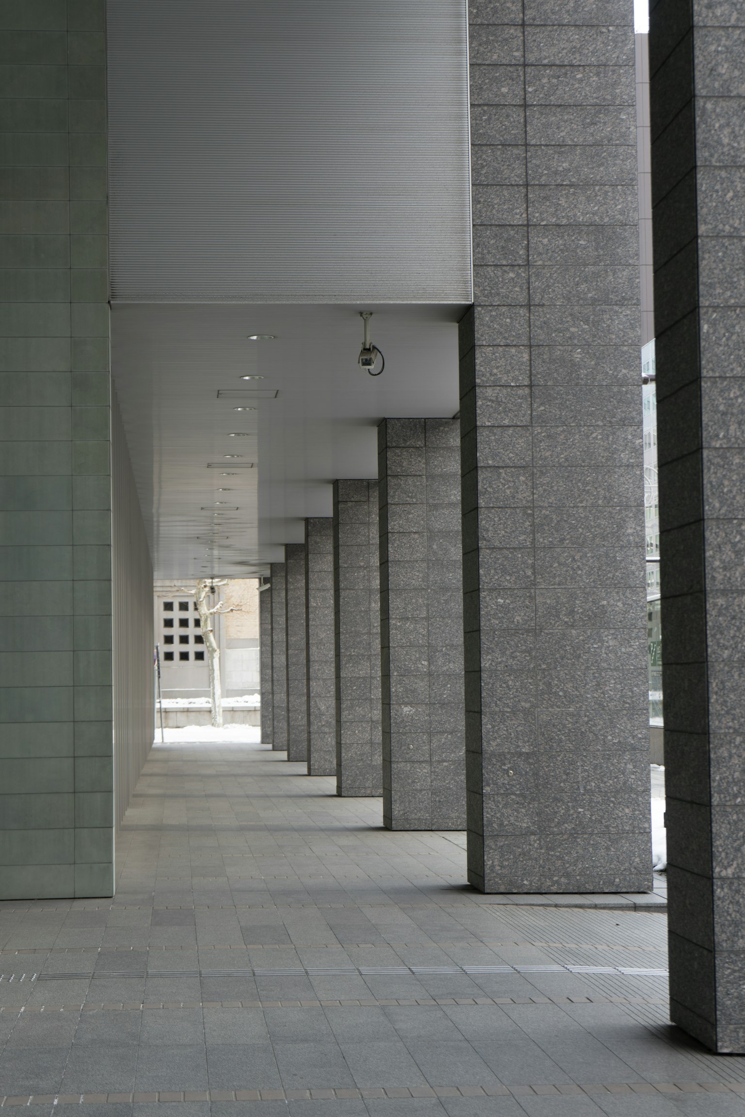 Photo of a corridor with modern architectural pillars