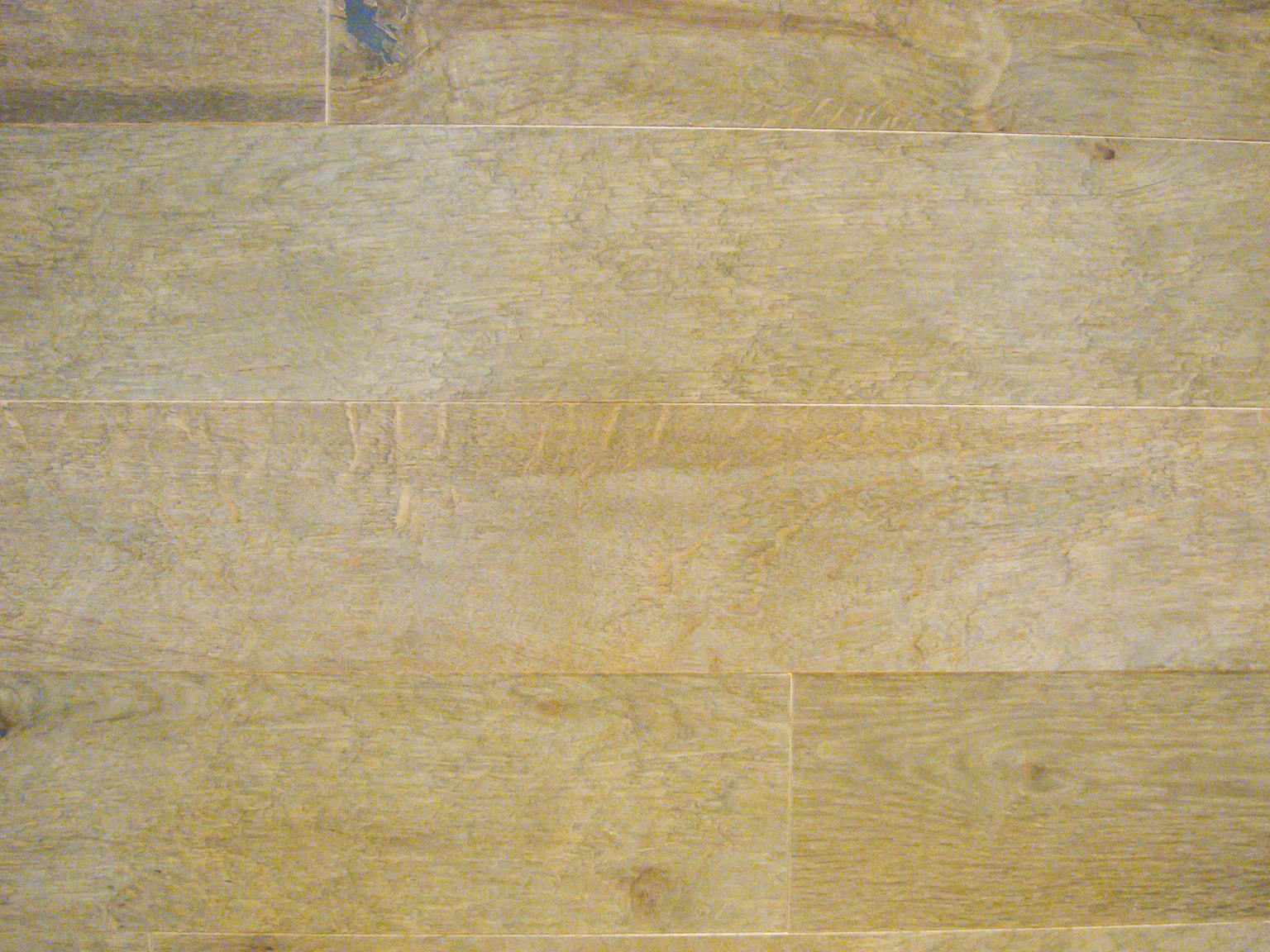 Light wood textured flooring with natural grain patterns