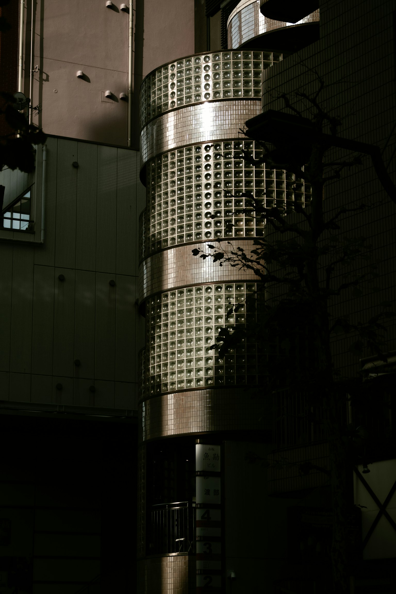 Part of a building with metallic texture and shadow