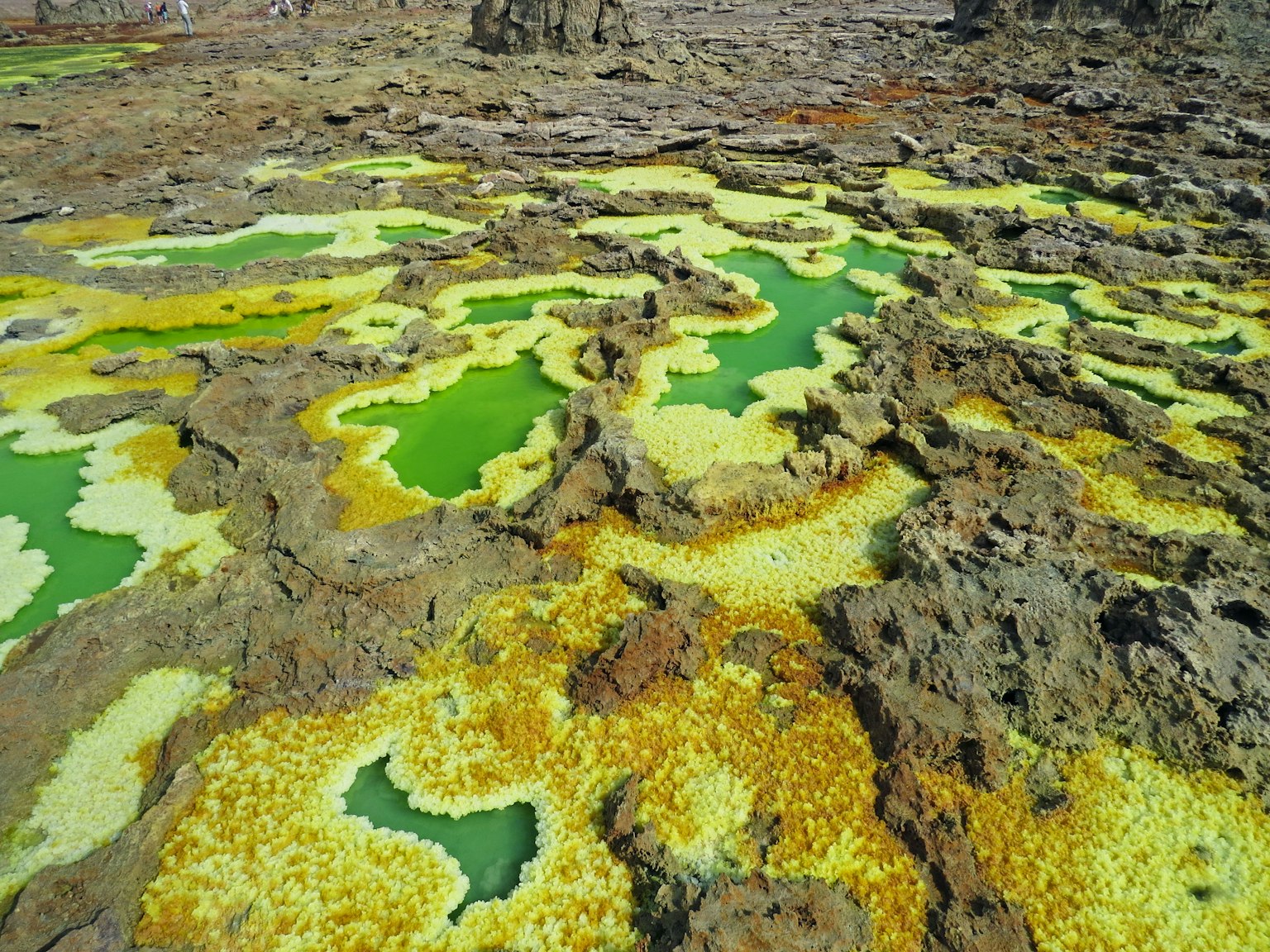 Landscape with green pools and rocky formations