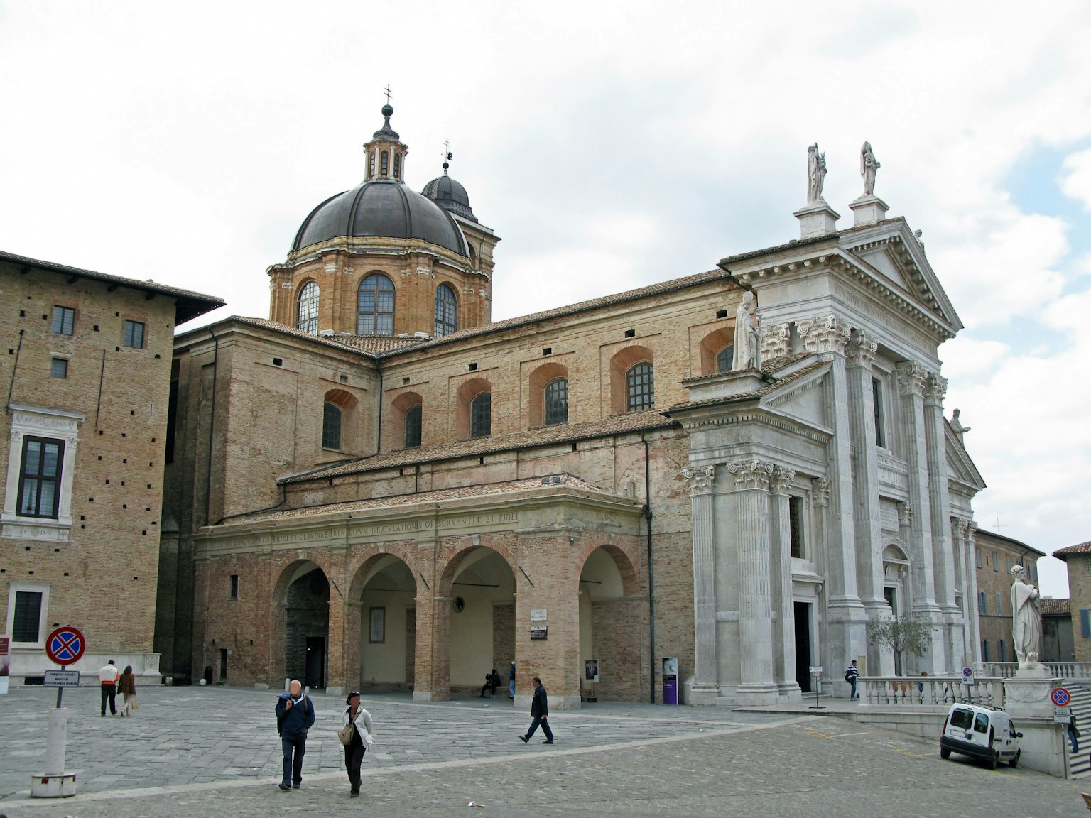 Historic building with people in the square