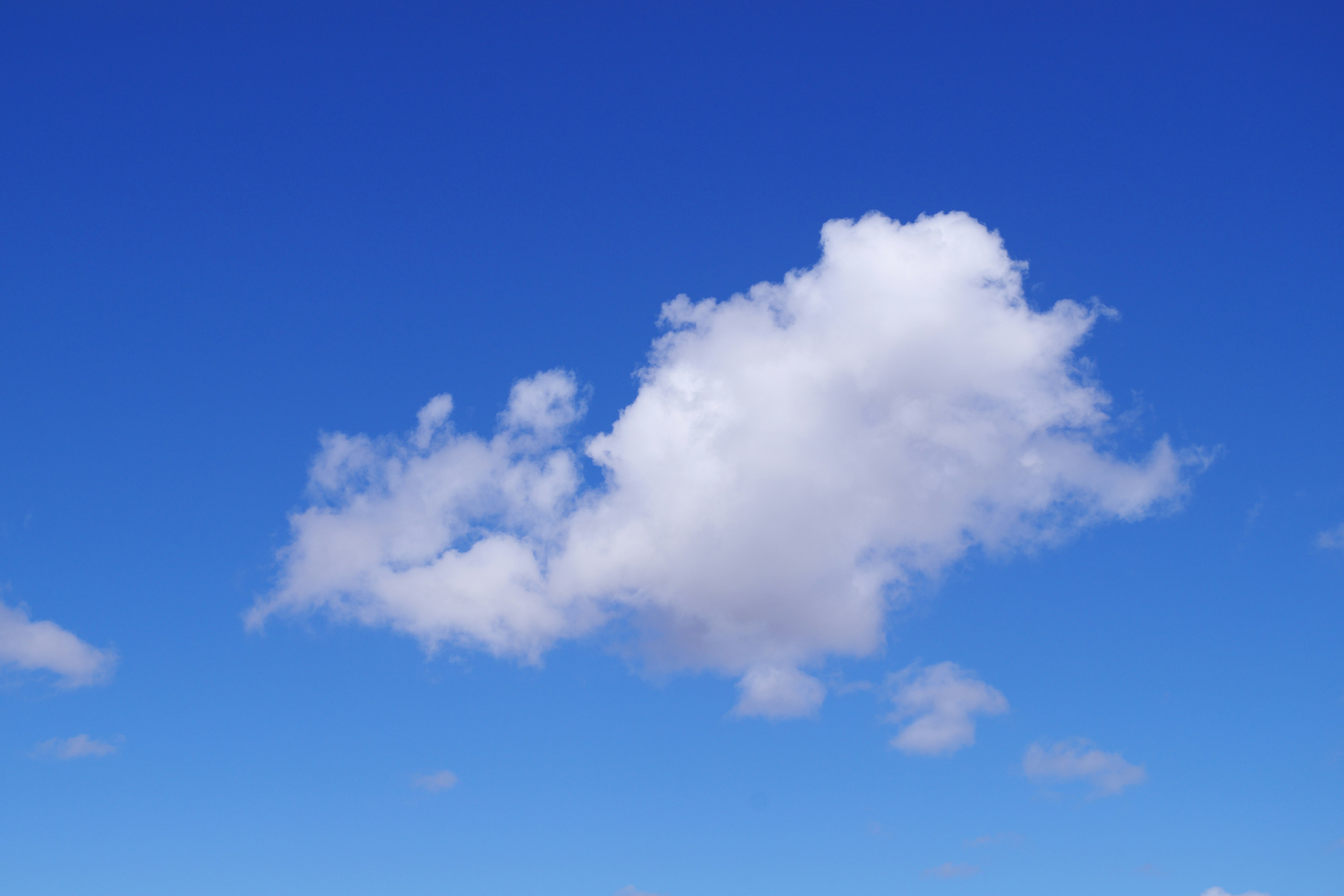 large cloud floating in a blue sky