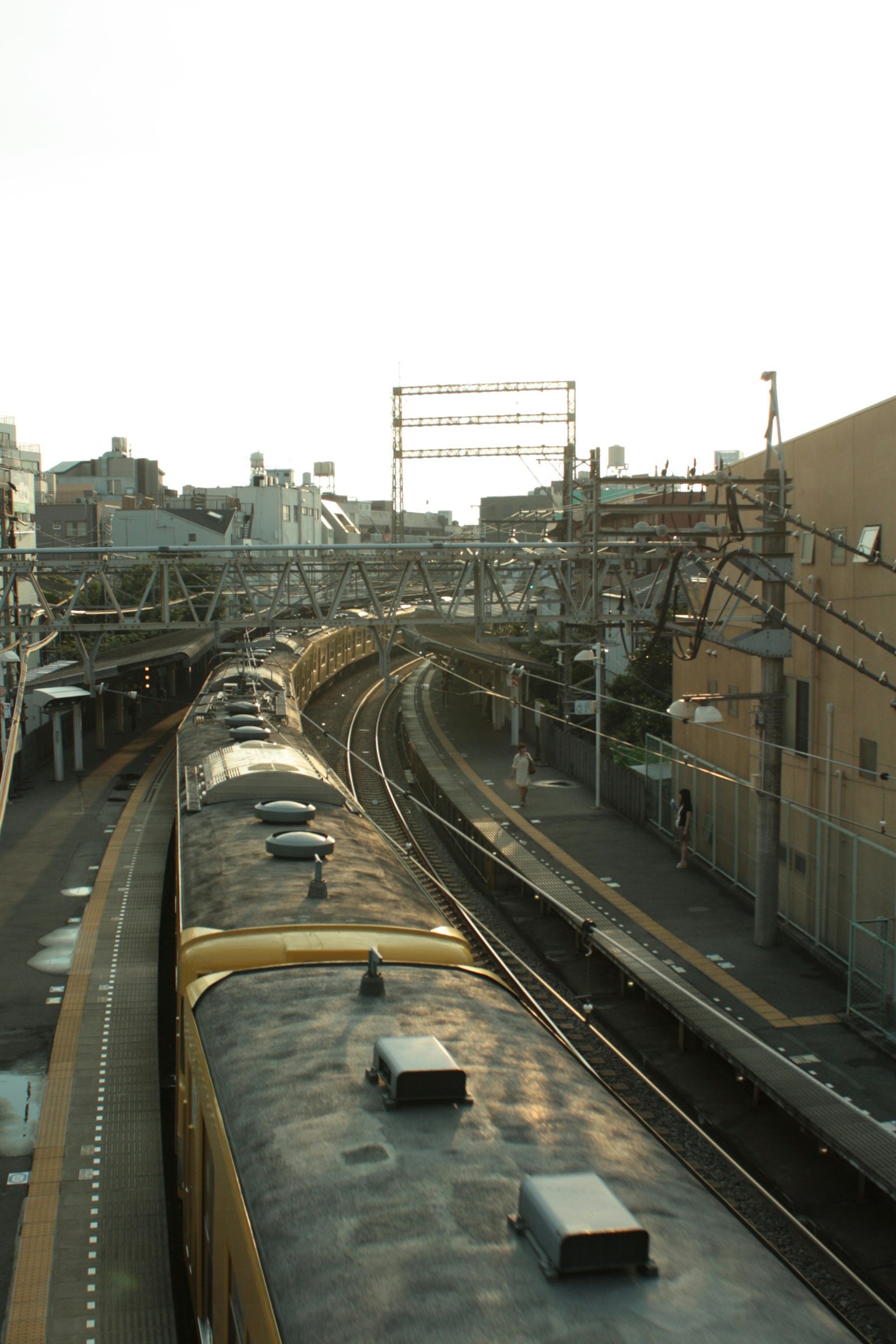 Urban railway curving through the city visible tracks and surrounding buildings
