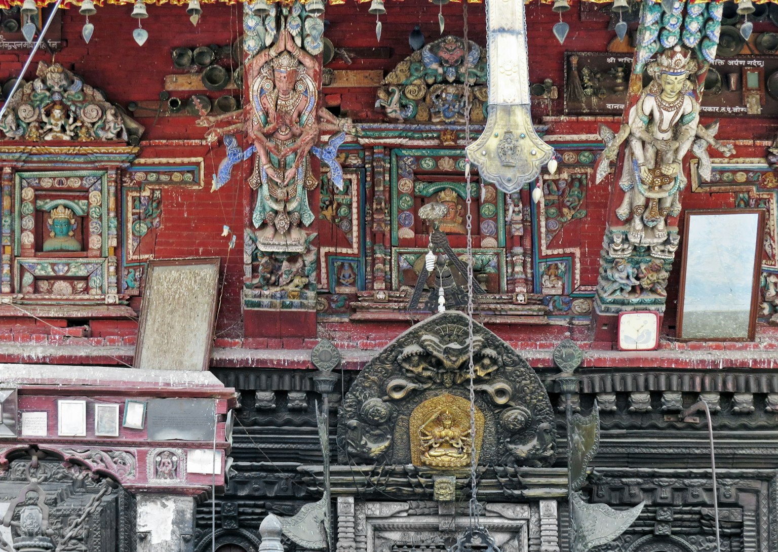 Intricate carvings and vibrant decorations on a temple wall