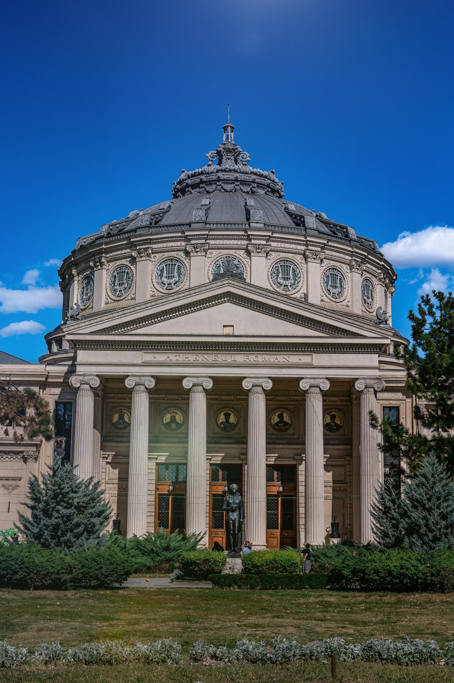 Exterior view of a cultural building with a dome and columns
