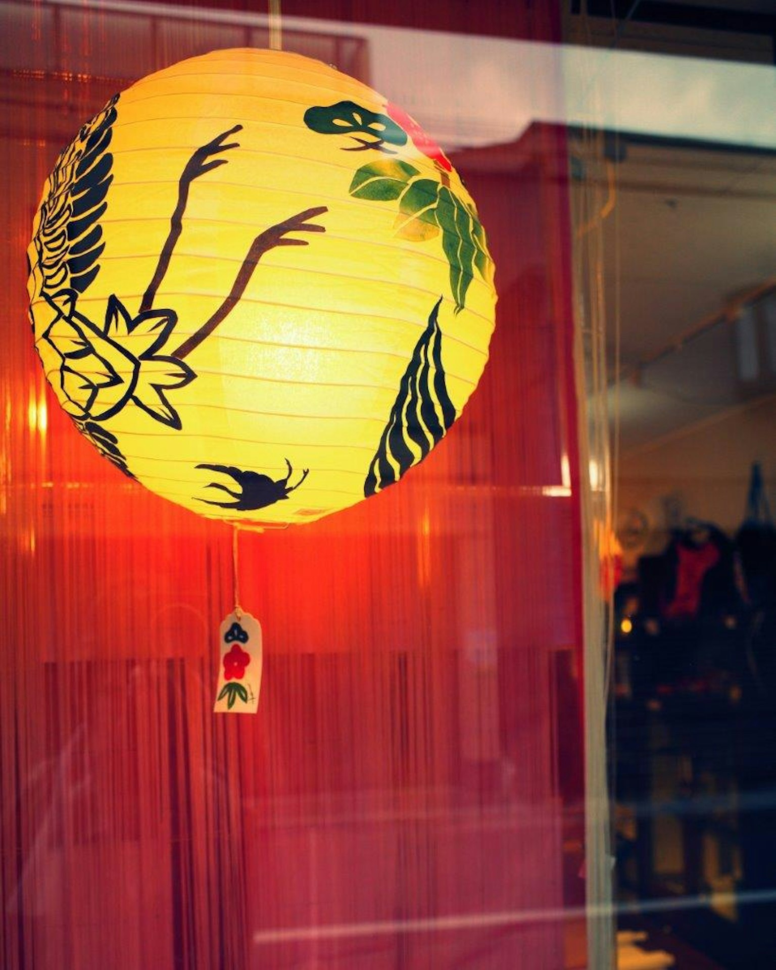 Yellow lantern featuring floral and leaf designs