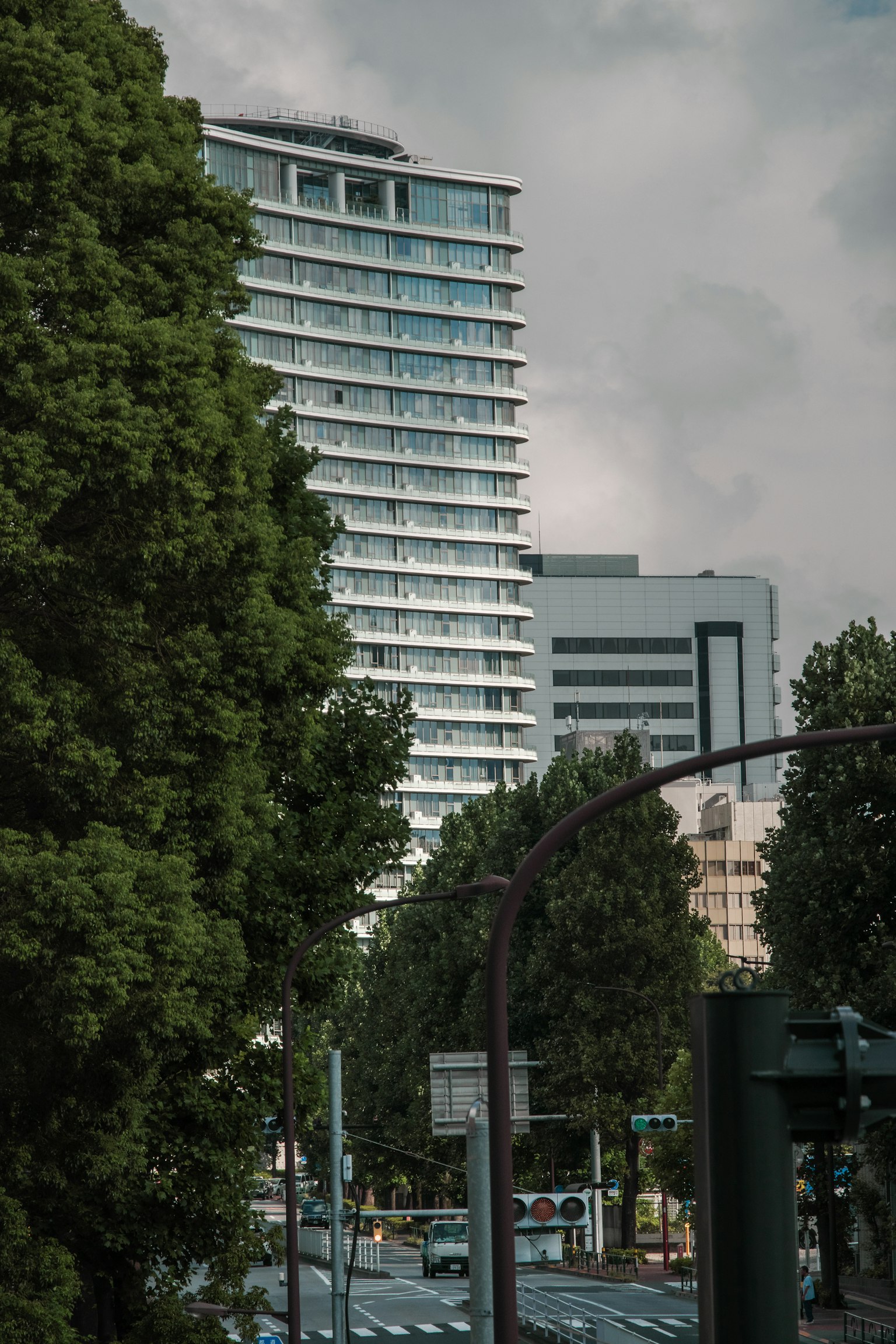 Urban landscape featuring tall buildings and lush green trees