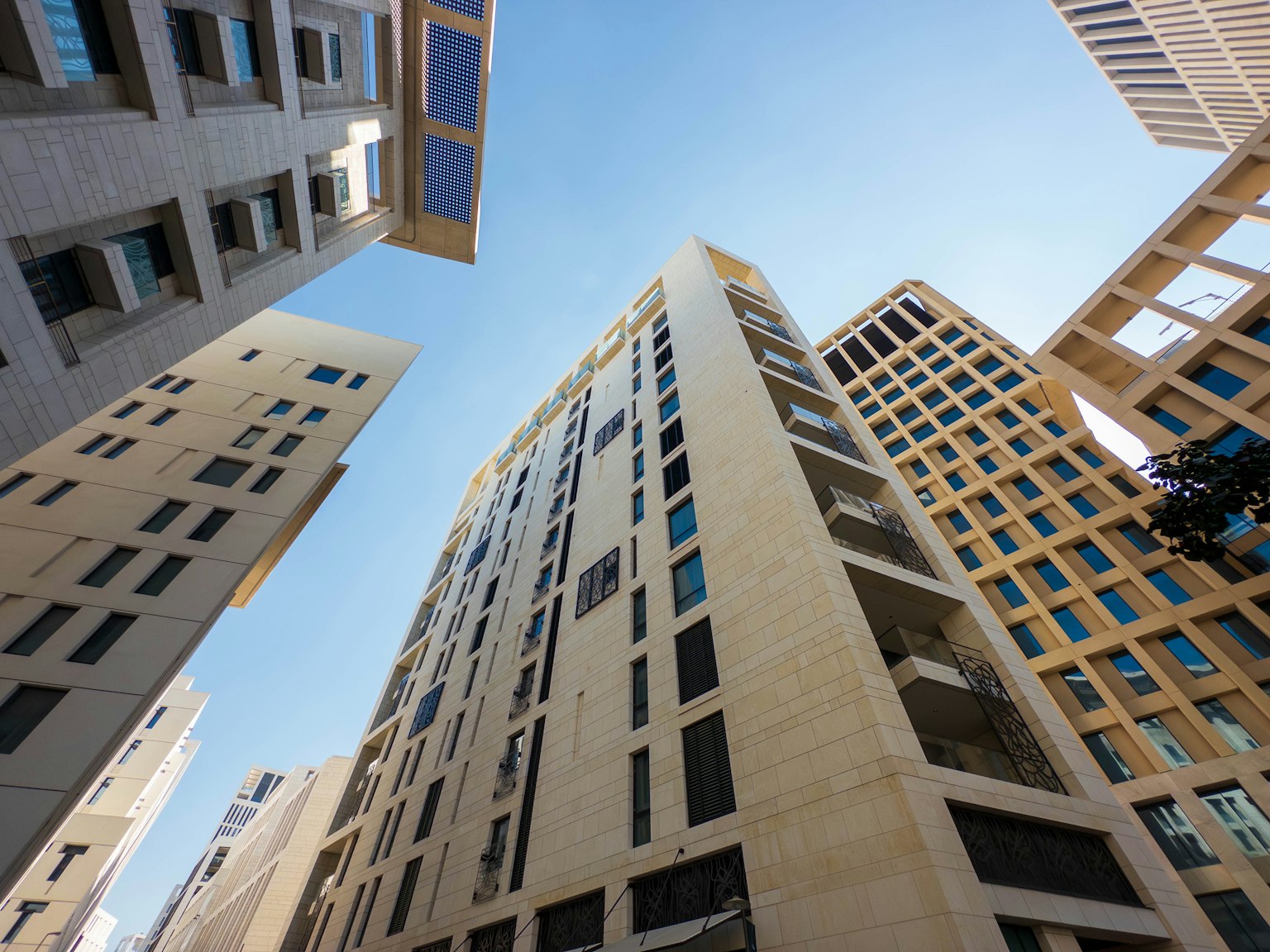 Urban landscape featuring high-rise buildings against a blue sky