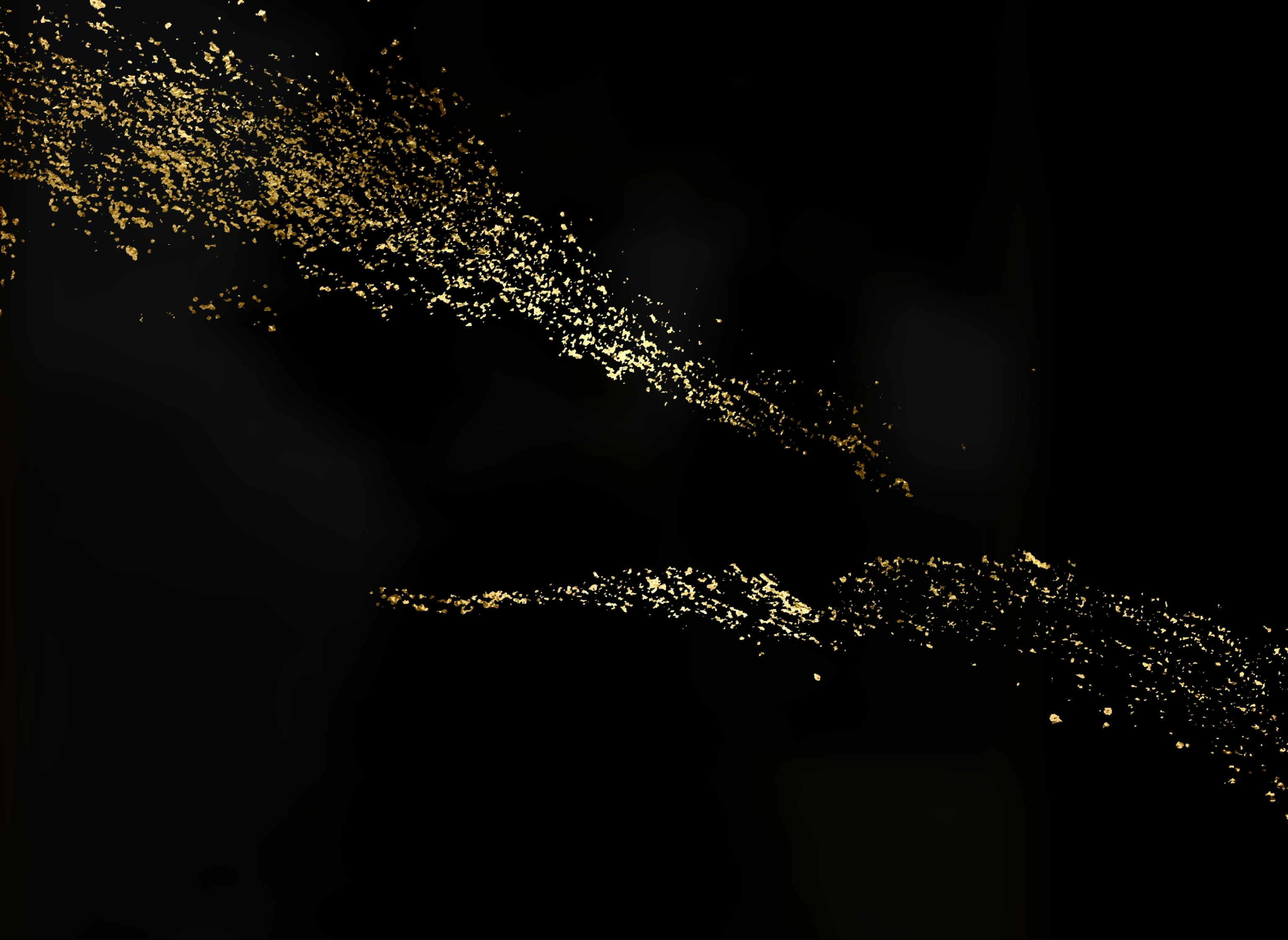 golden particles drifting across a dark background