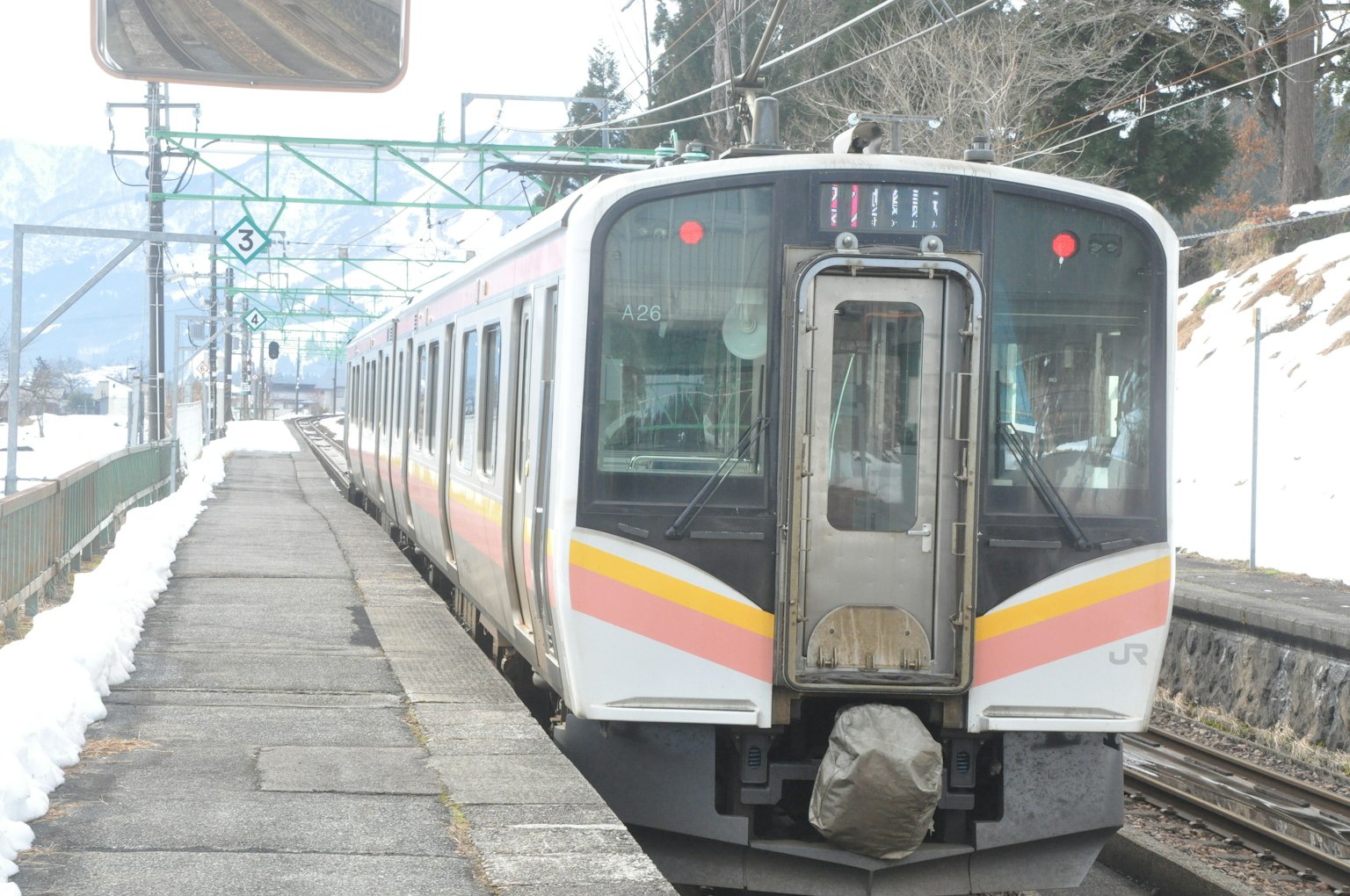 Train stopped at a snowy station