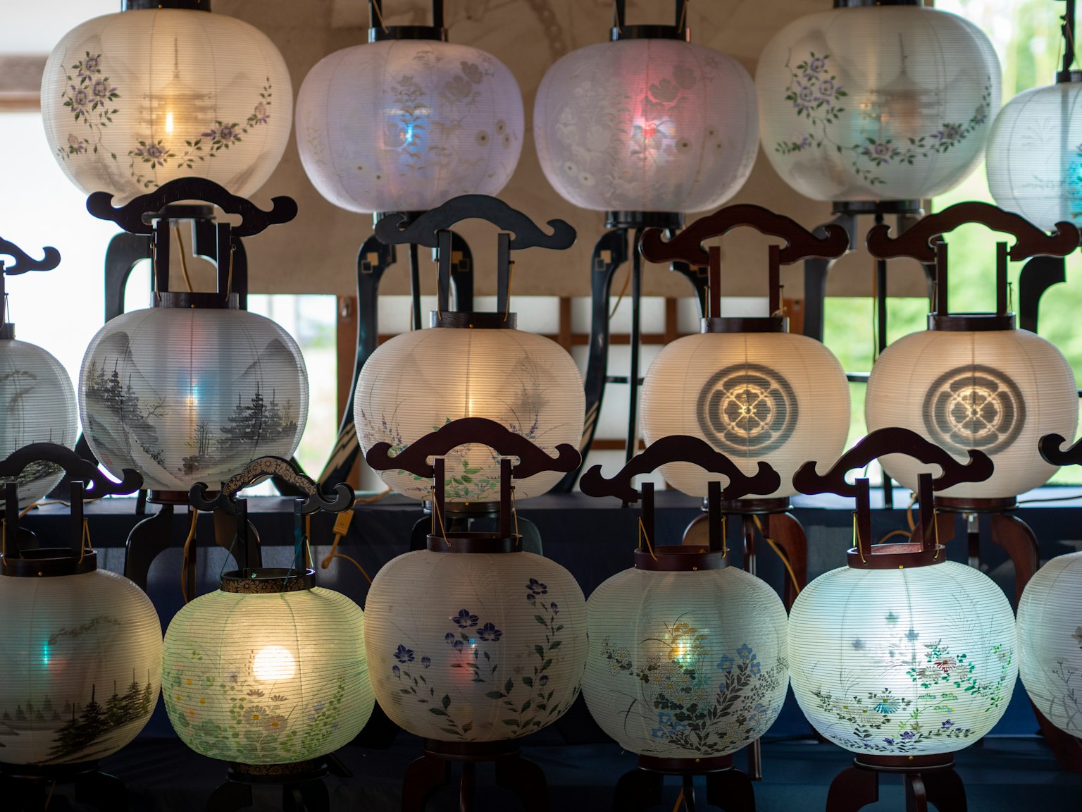A collection of beautifully designed lanterns with soft glowing lights