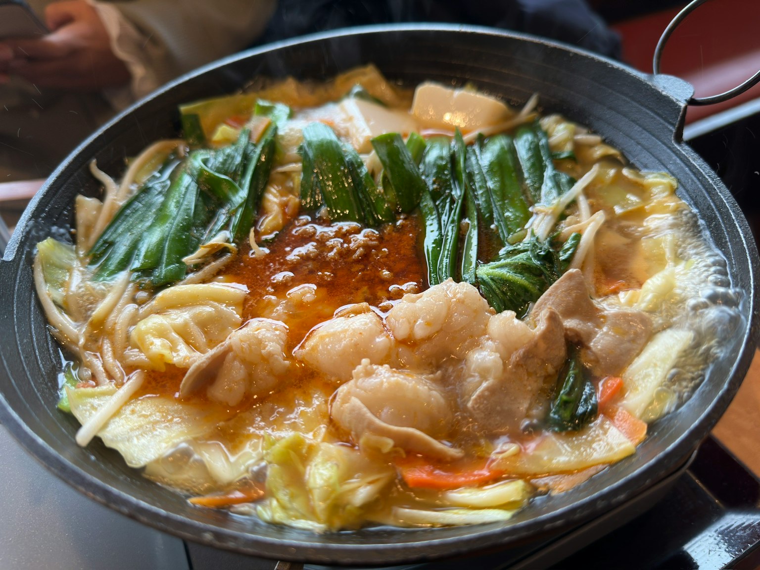 A pot of hot dish featuring meat and vegetables