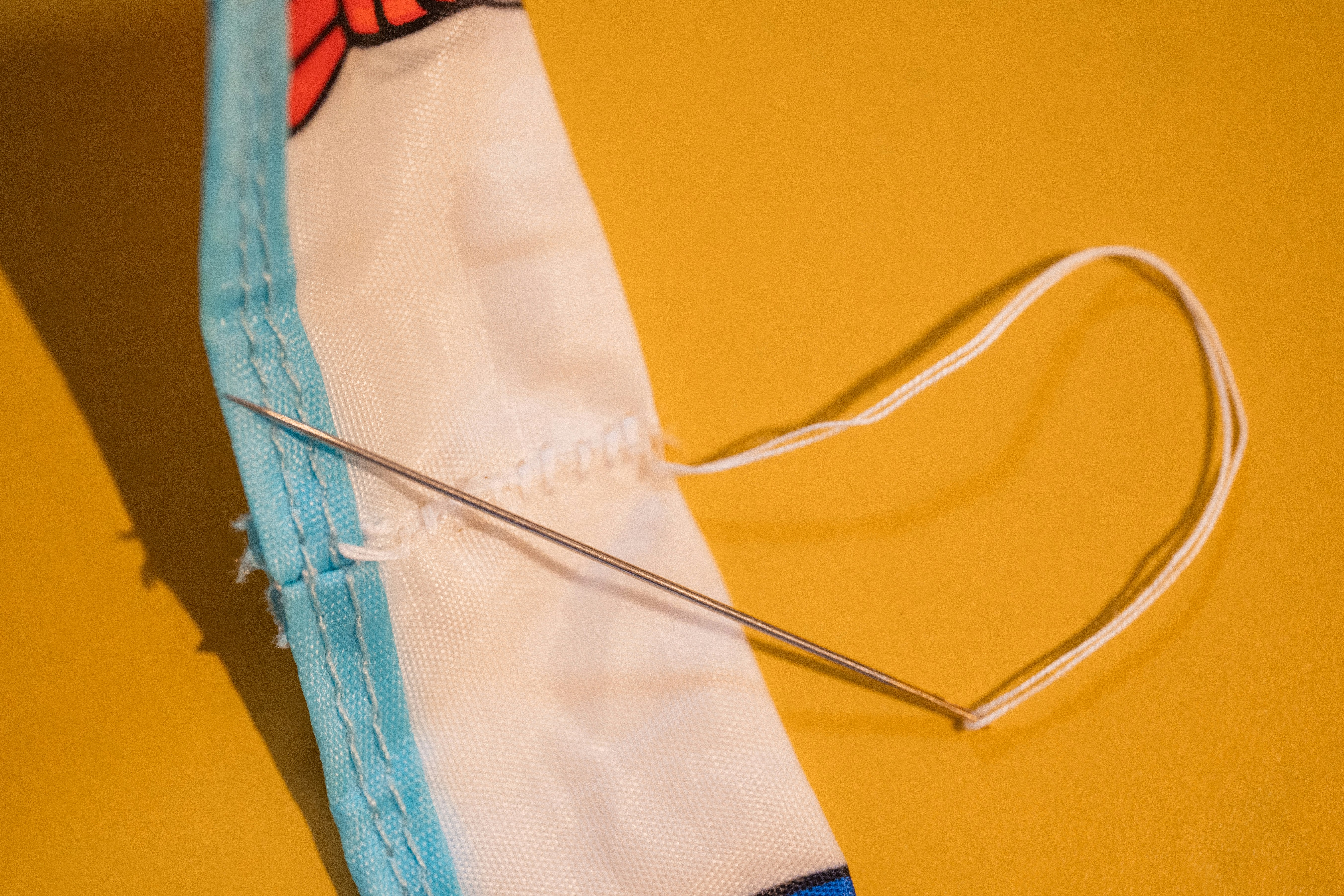 Close-up of a repaired eco bag handle