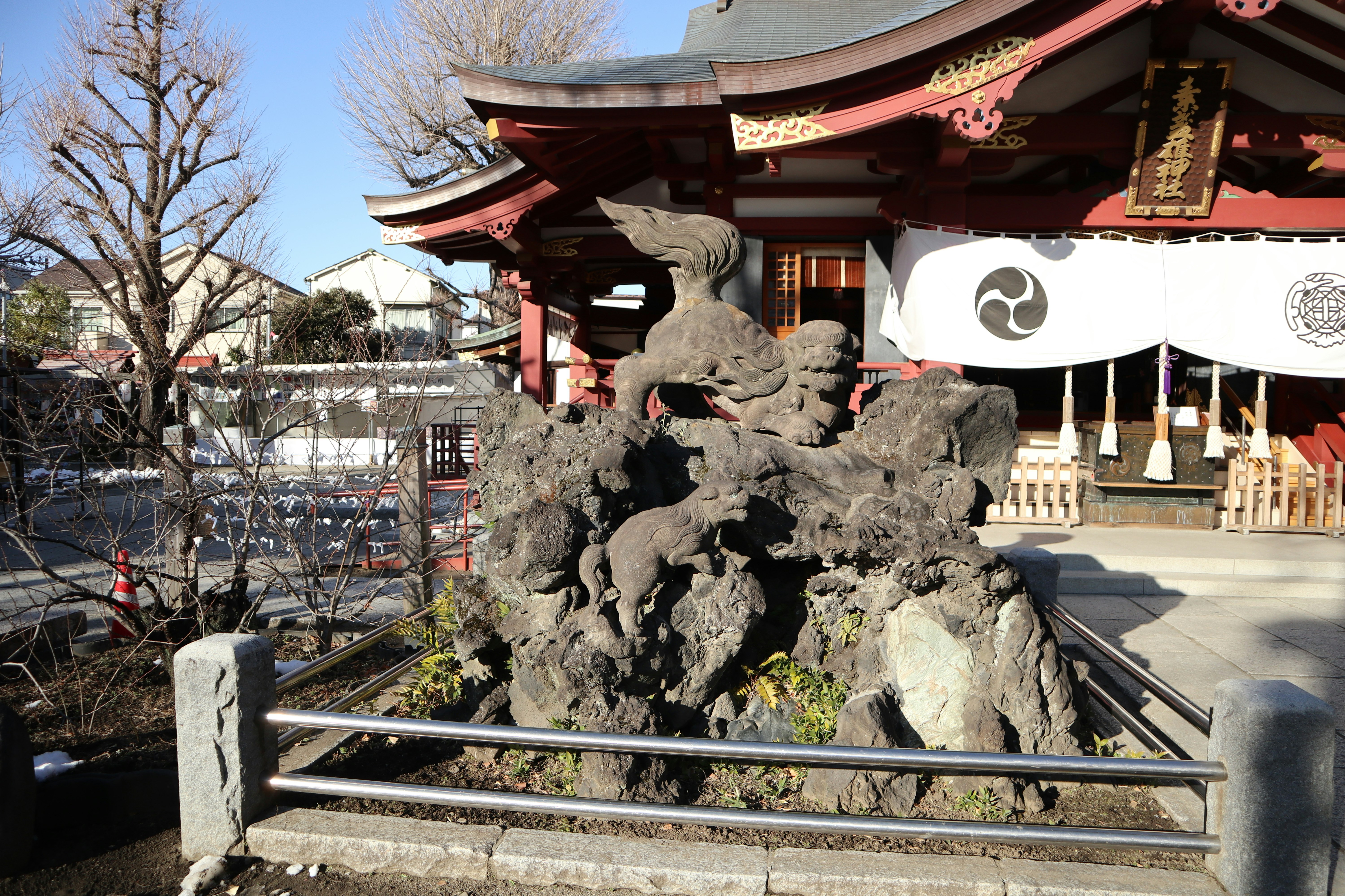 stone lion statues at a shrine entrance
