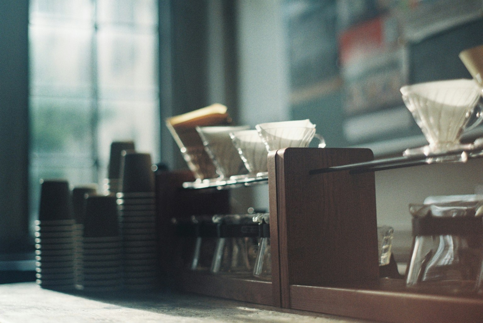 A view of coffee brewing equipment arranged on a cafe table