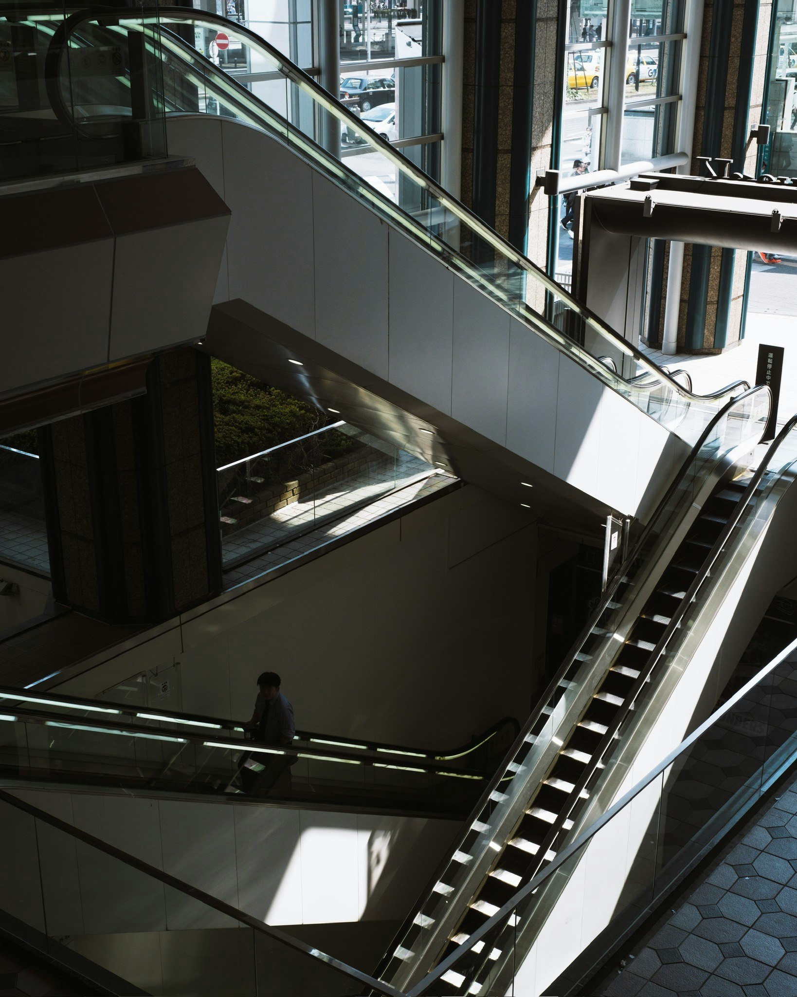 Atrium with an escalator inside a glass building