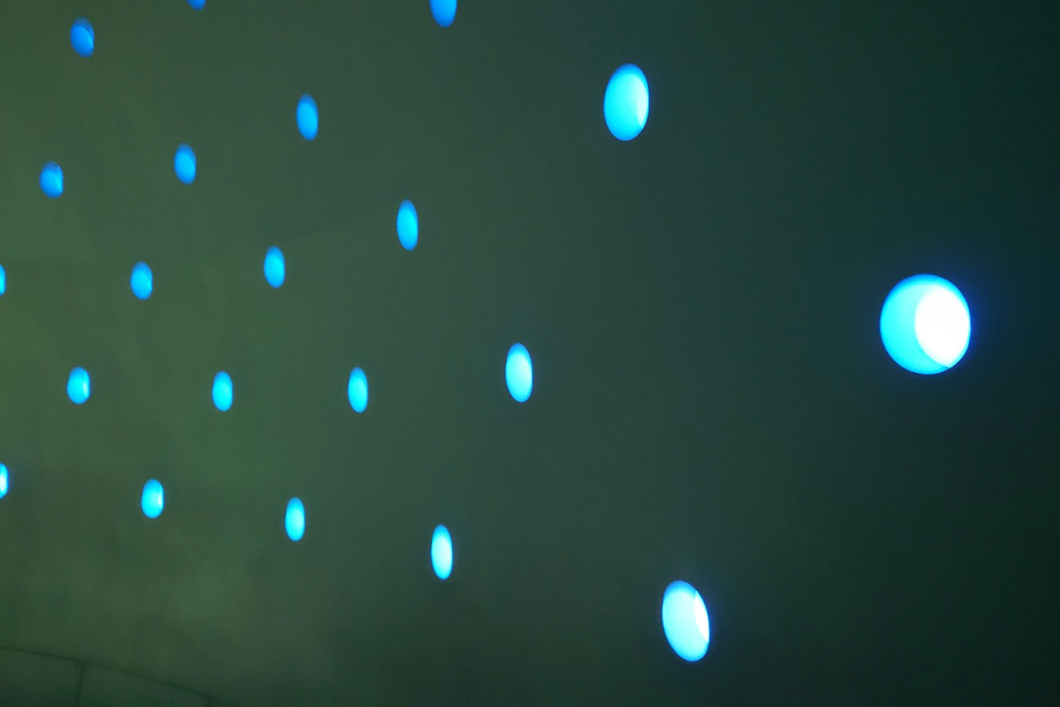 Wall display with scattered blue lights
