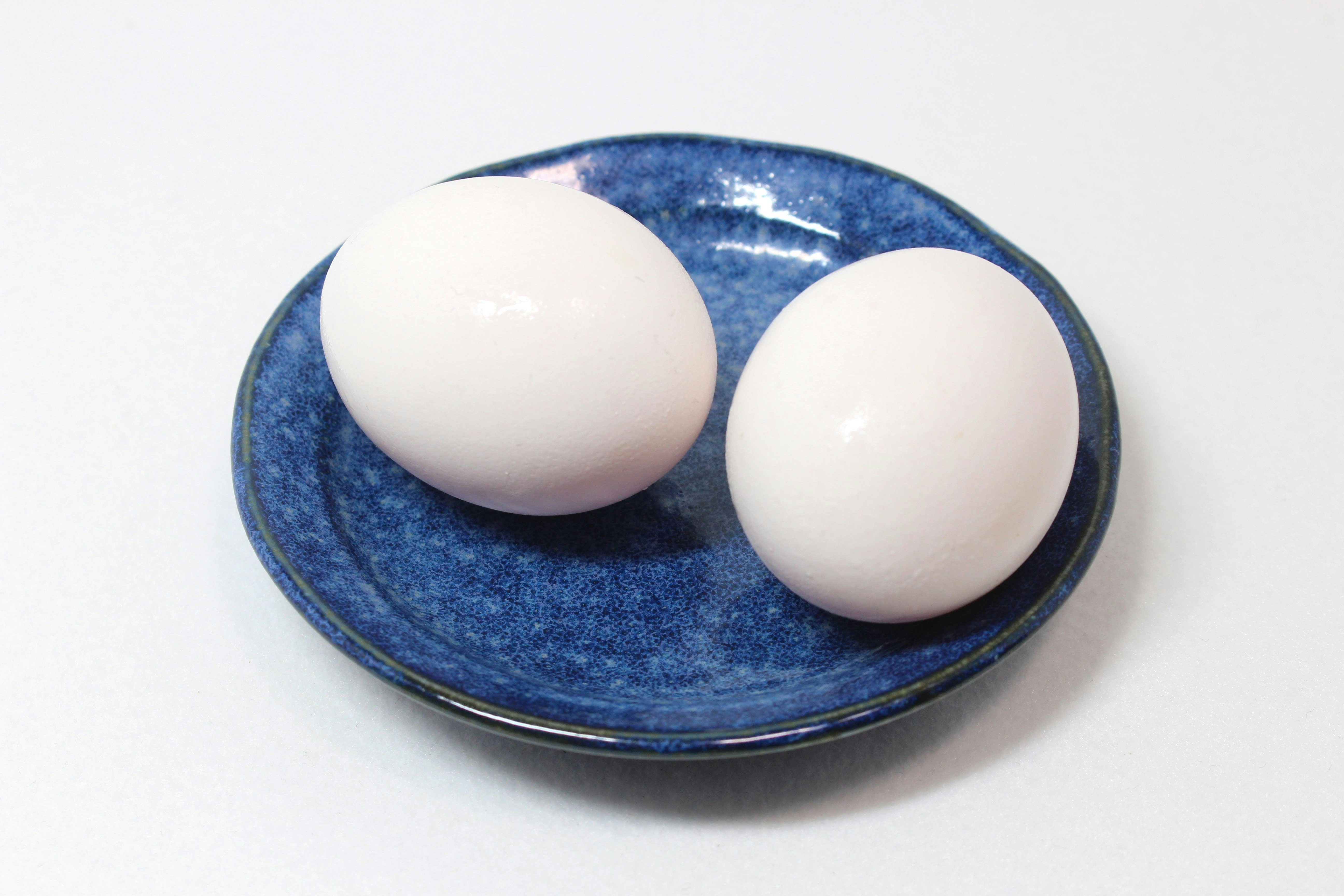 boiled eggs on a blue plate