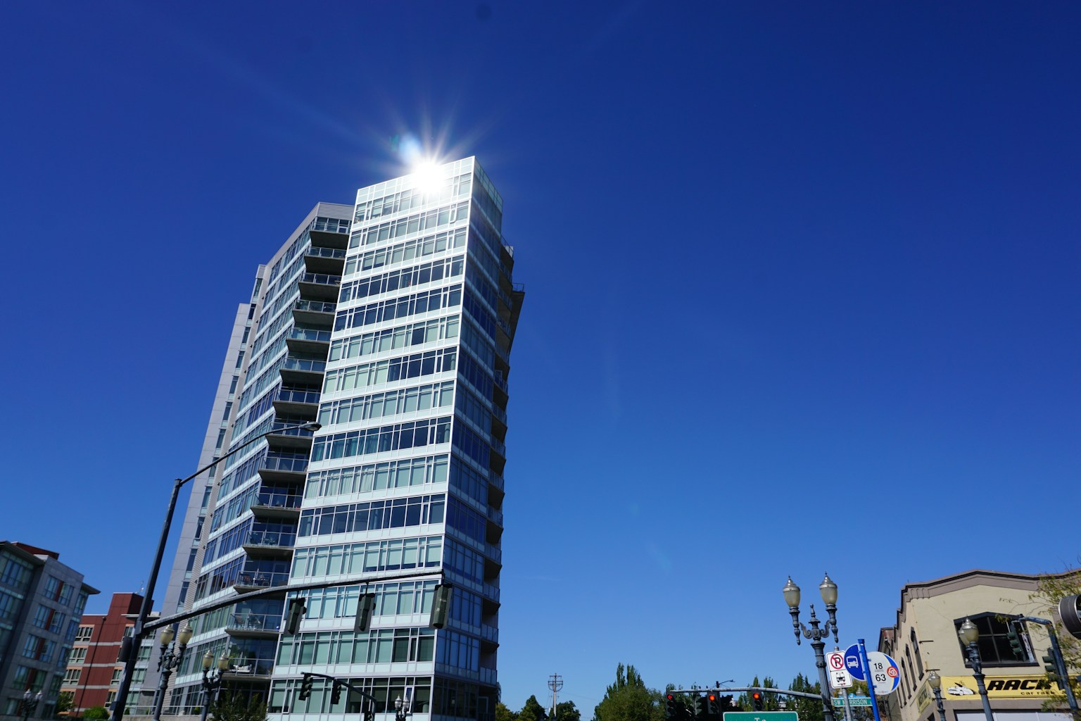 A modern building towering under a clear blue sky
