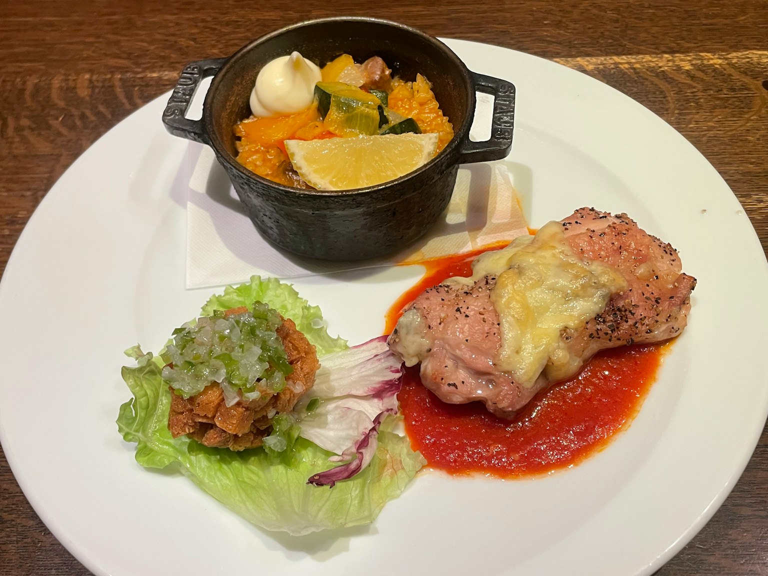 A beautifully presented plate featuring a main dish and side dish
