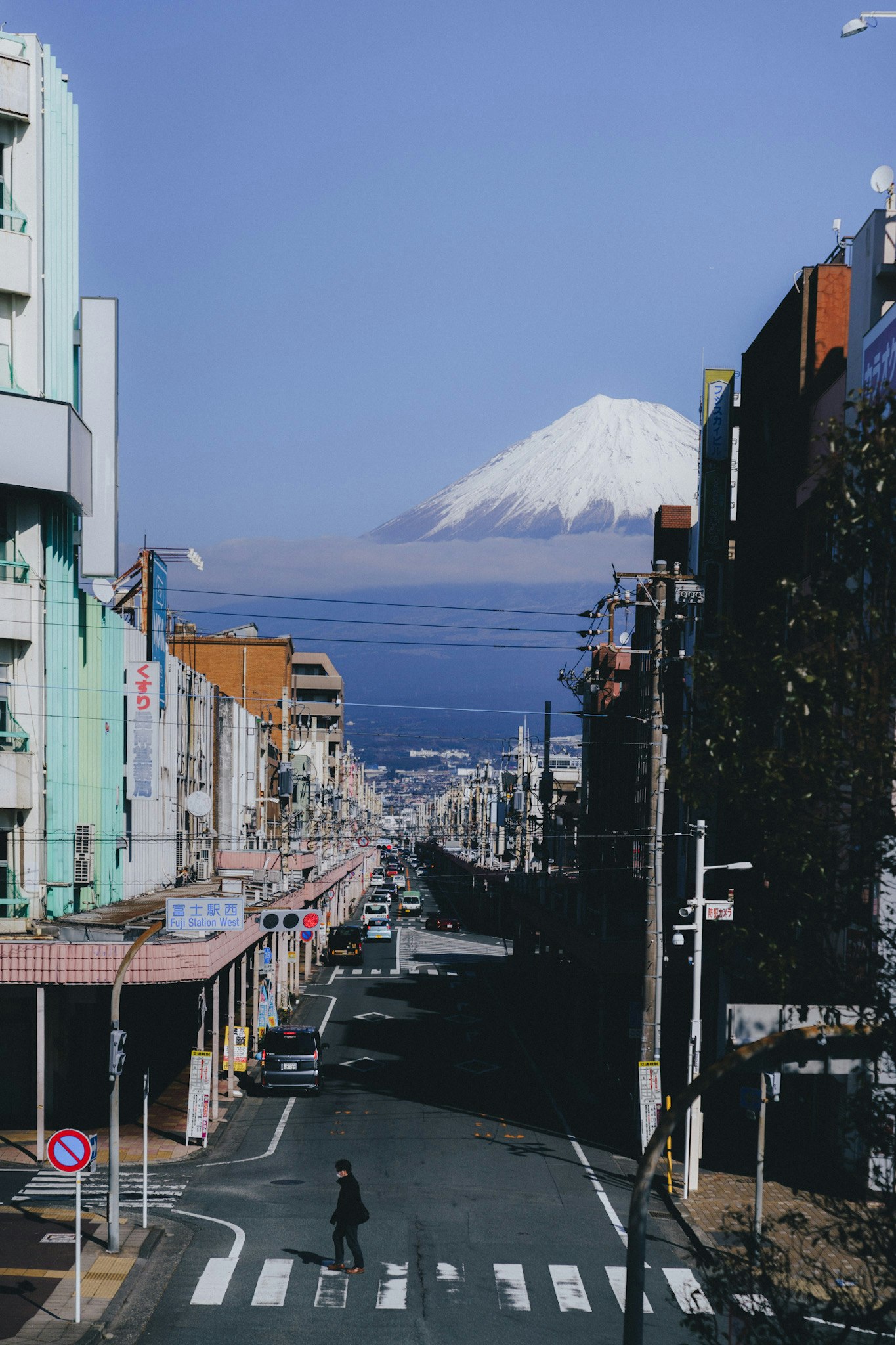 View of Mount Fuji from a narrow street