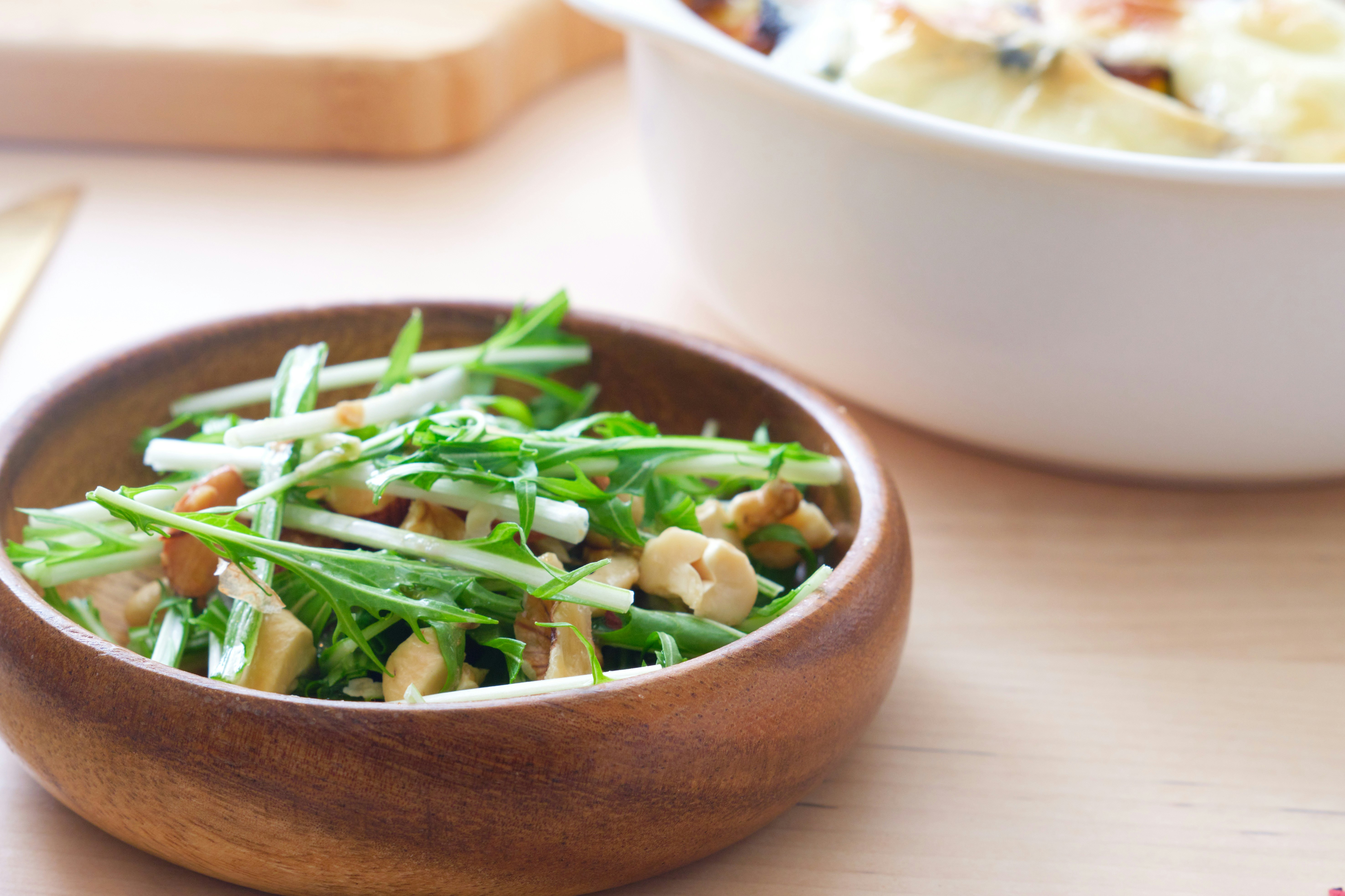 wooden bowl of scallion and chicken dish