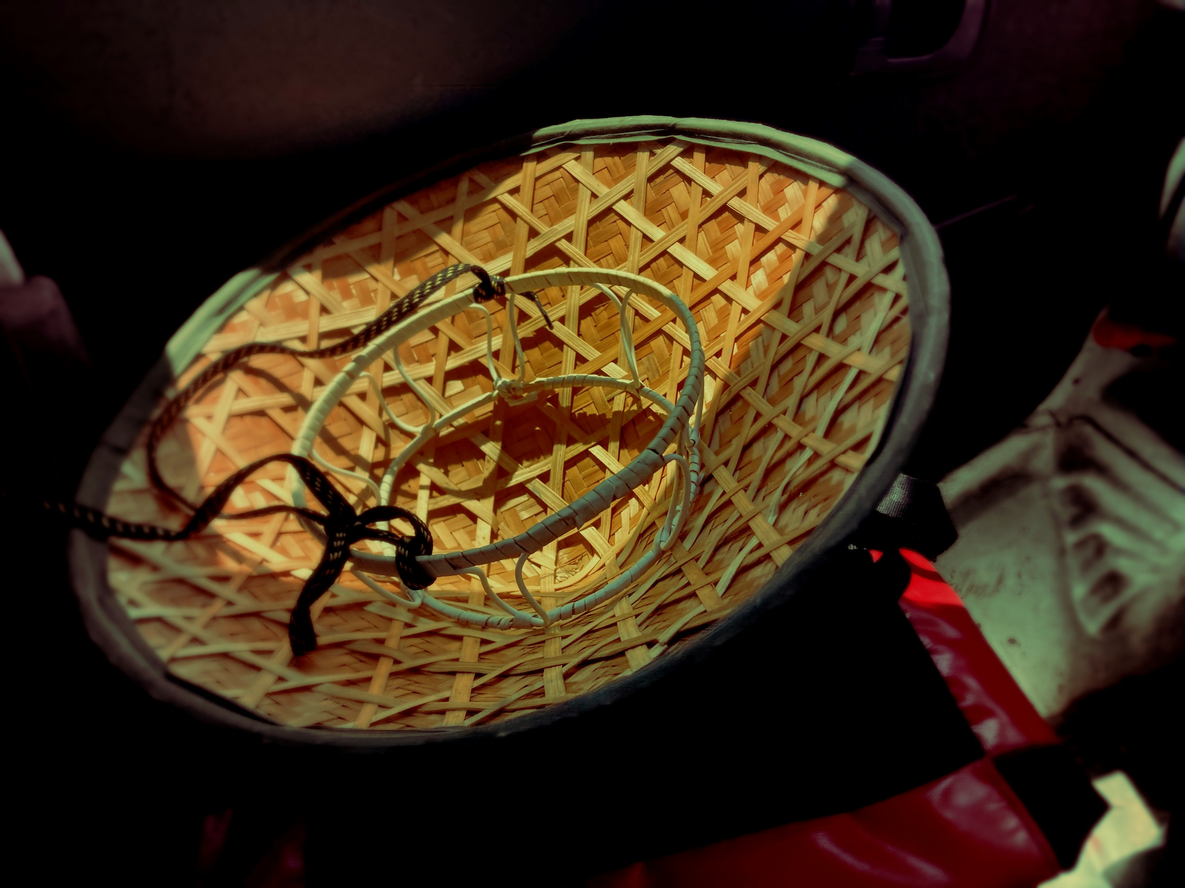 noodles-like food in a woven bamboo basket