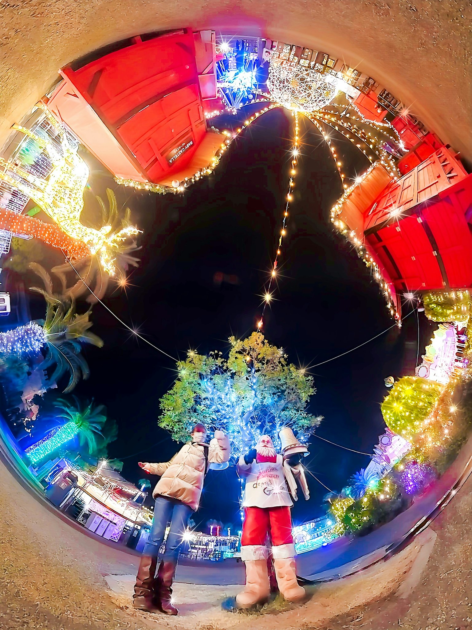 Two people enjoying a beautiful nighttime illumination display