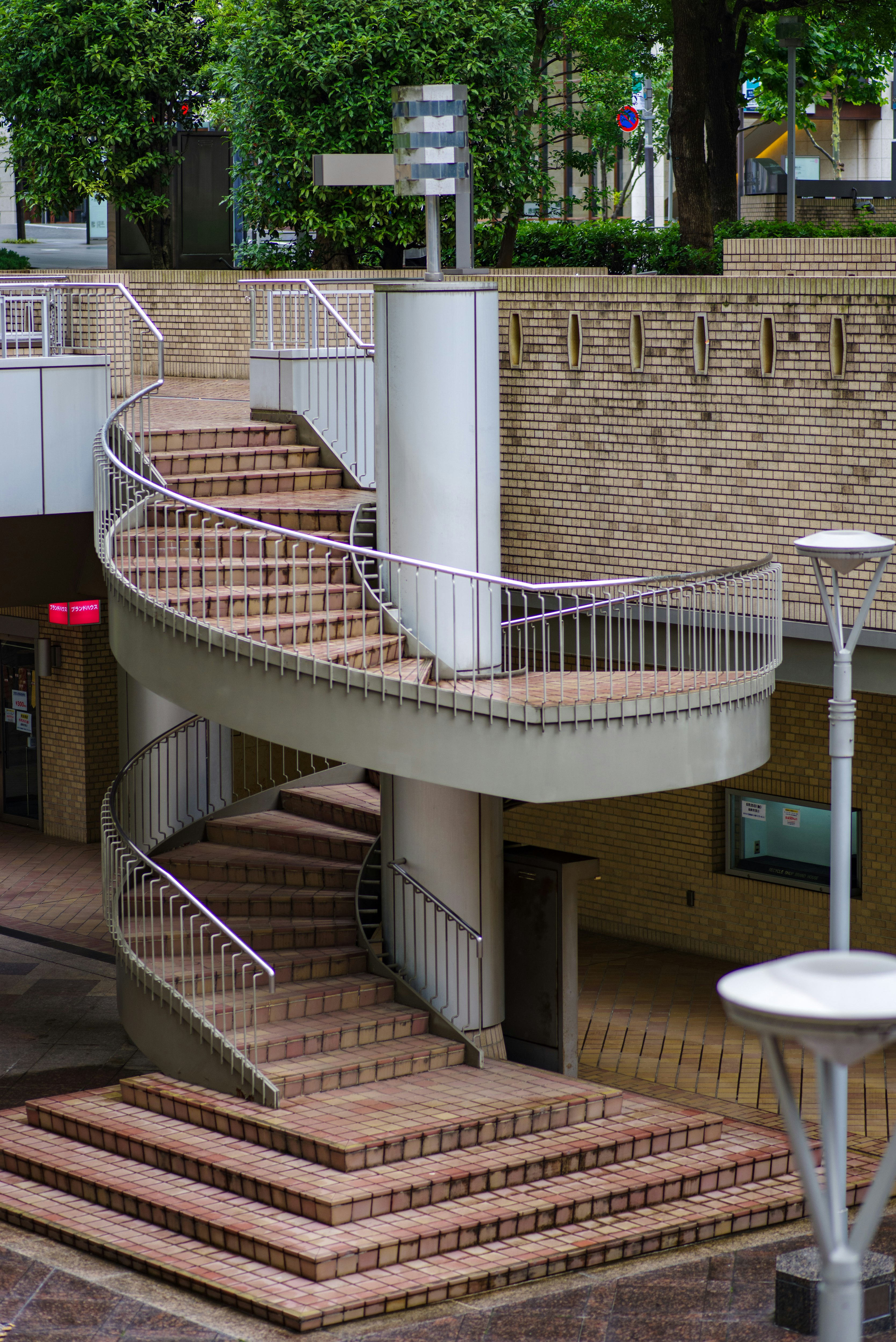 spiral staircase and brick wall courtyard architecture