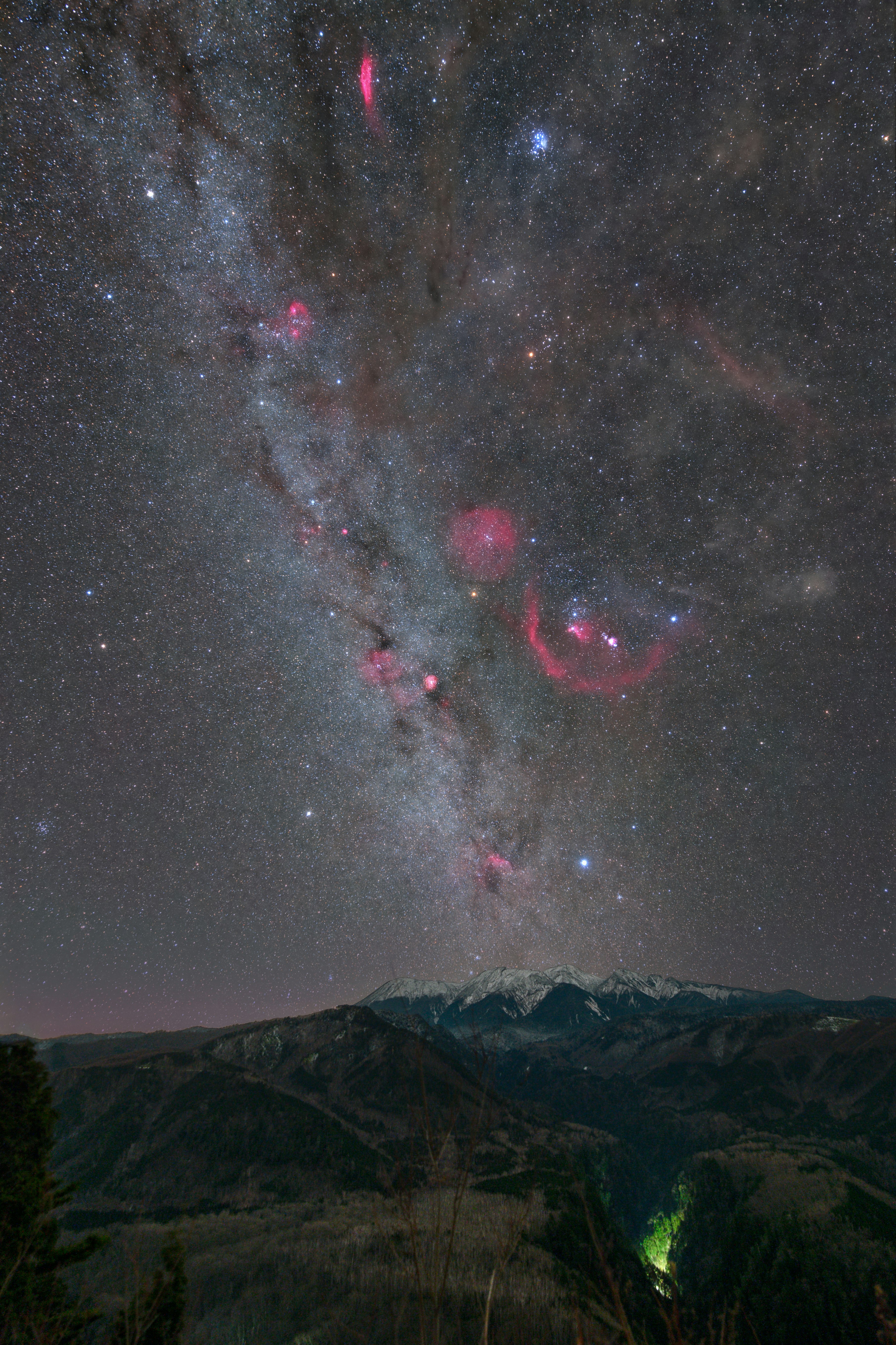 Milky Way and starry sky over mountain silhouettes