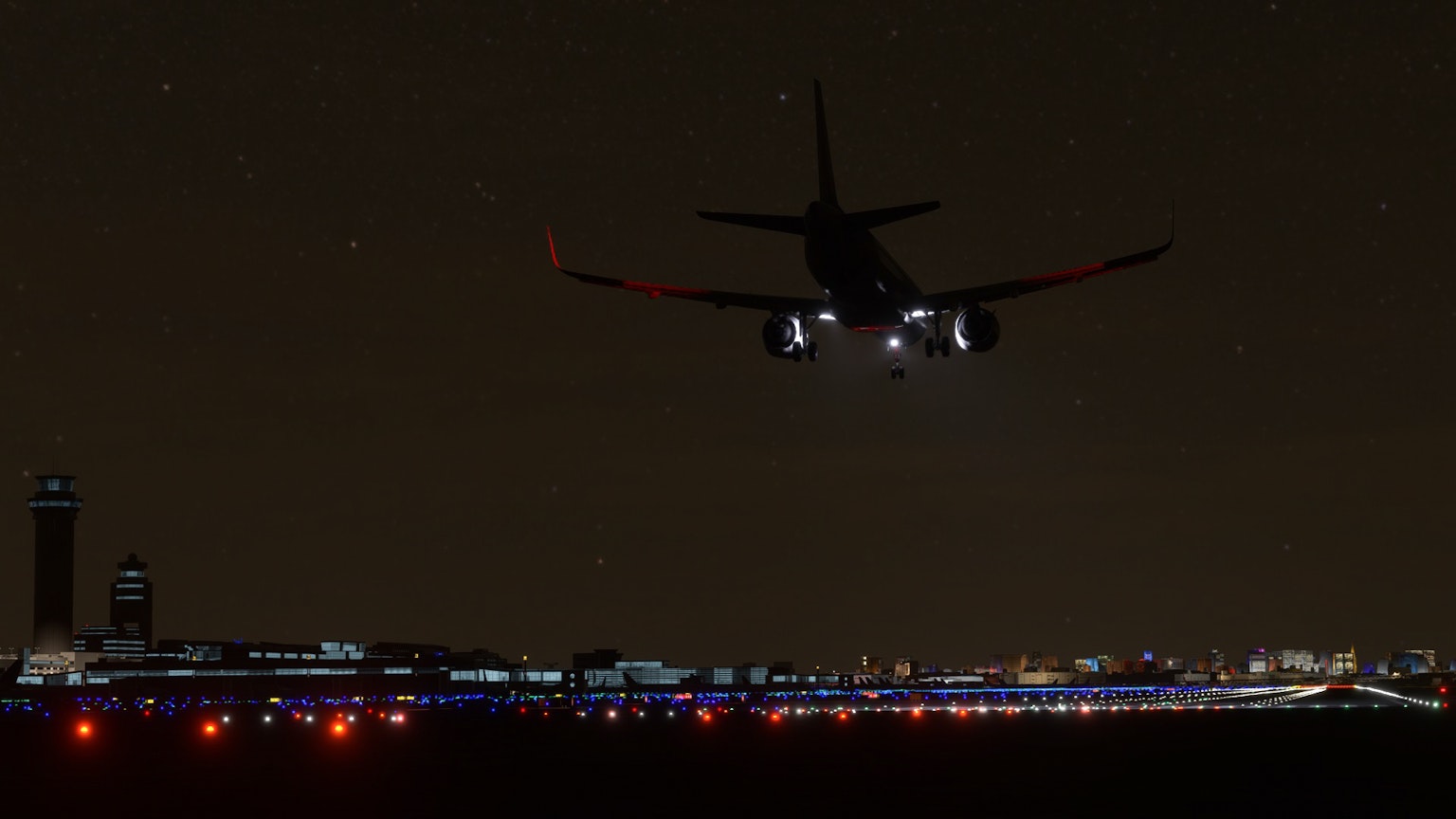 Flugzeug fliegt nachts mit Stadtlichtern darunter