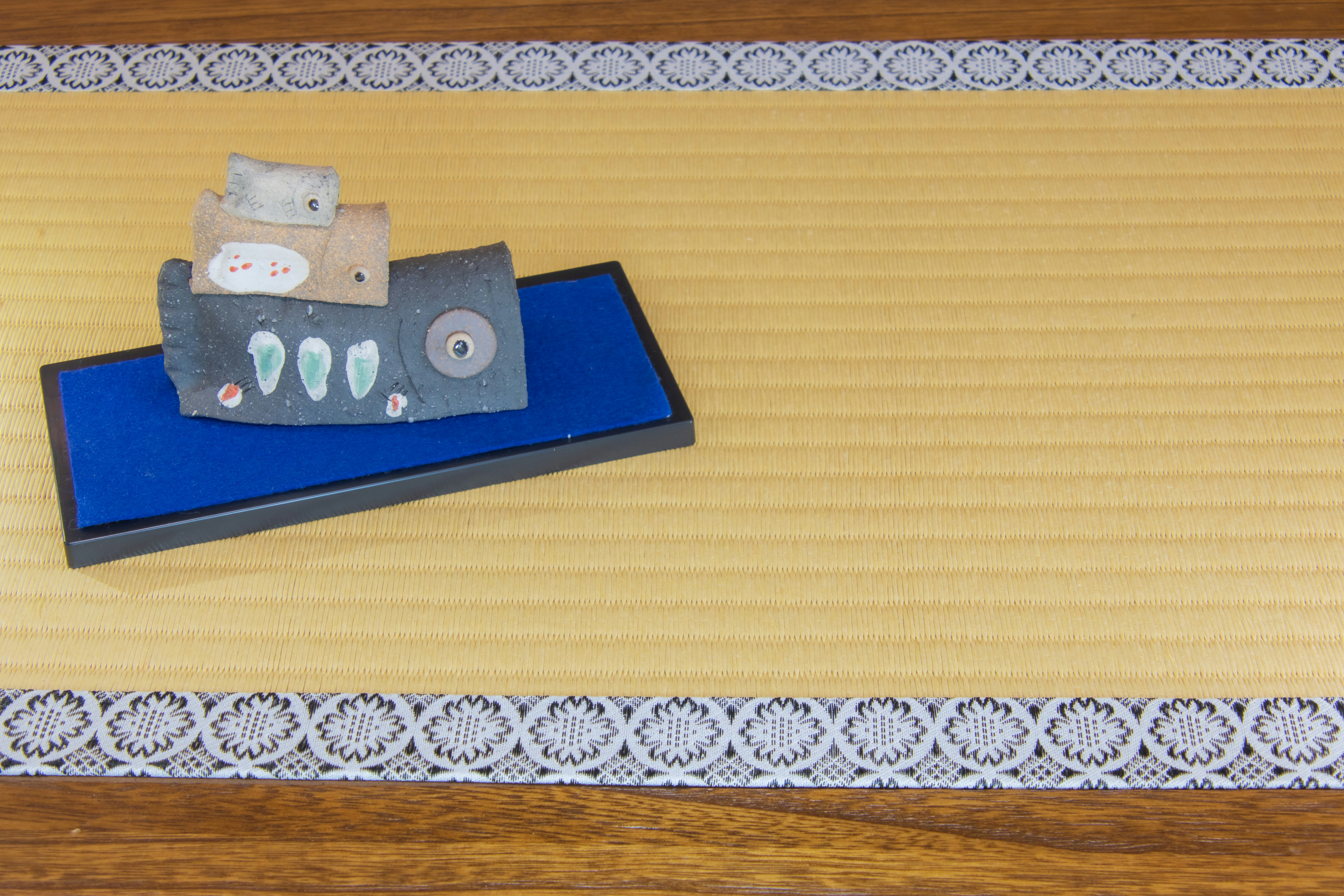 blue stationery and paper decorations on tatami