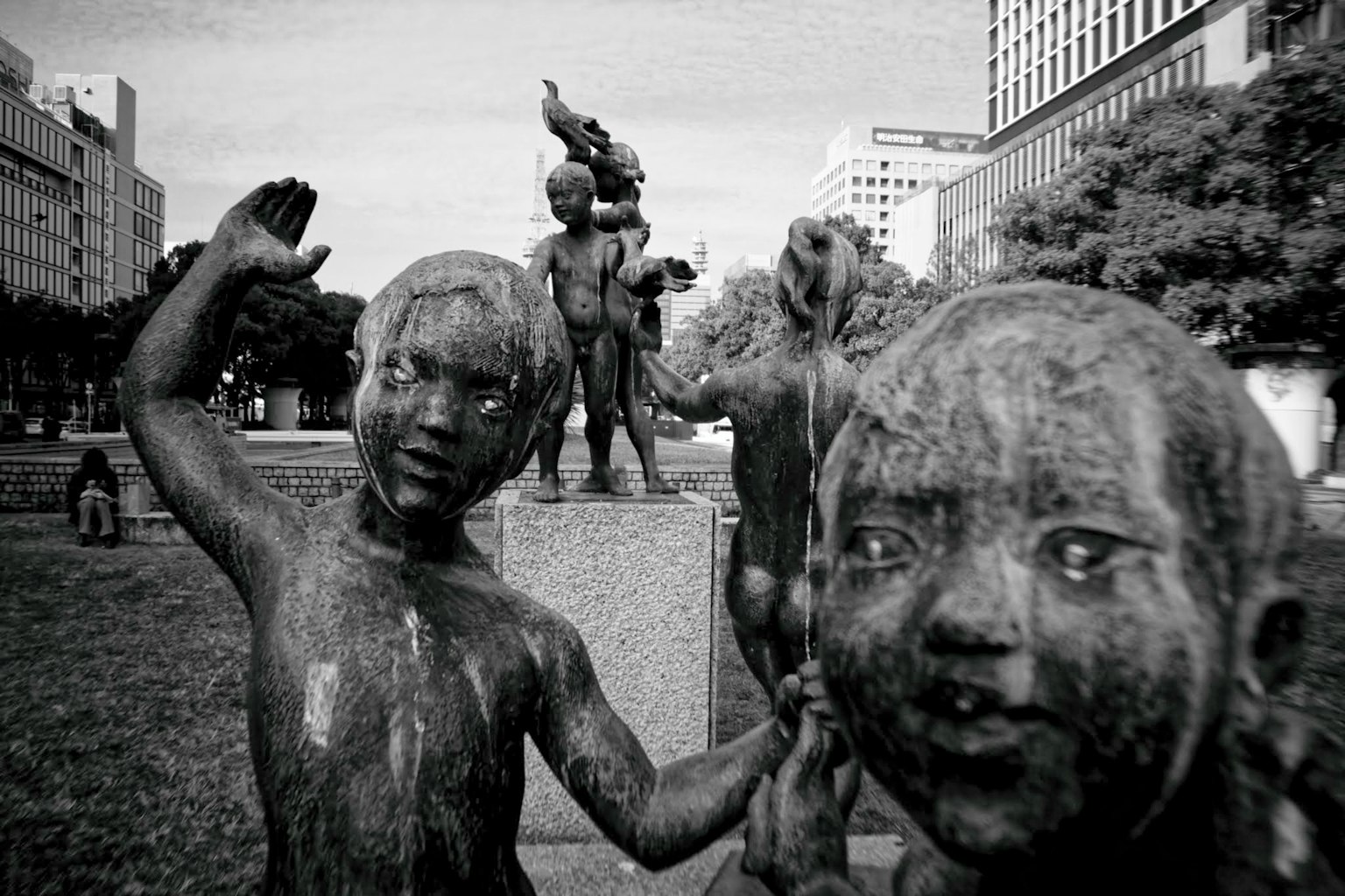 View of bronze sculptures of children in a park