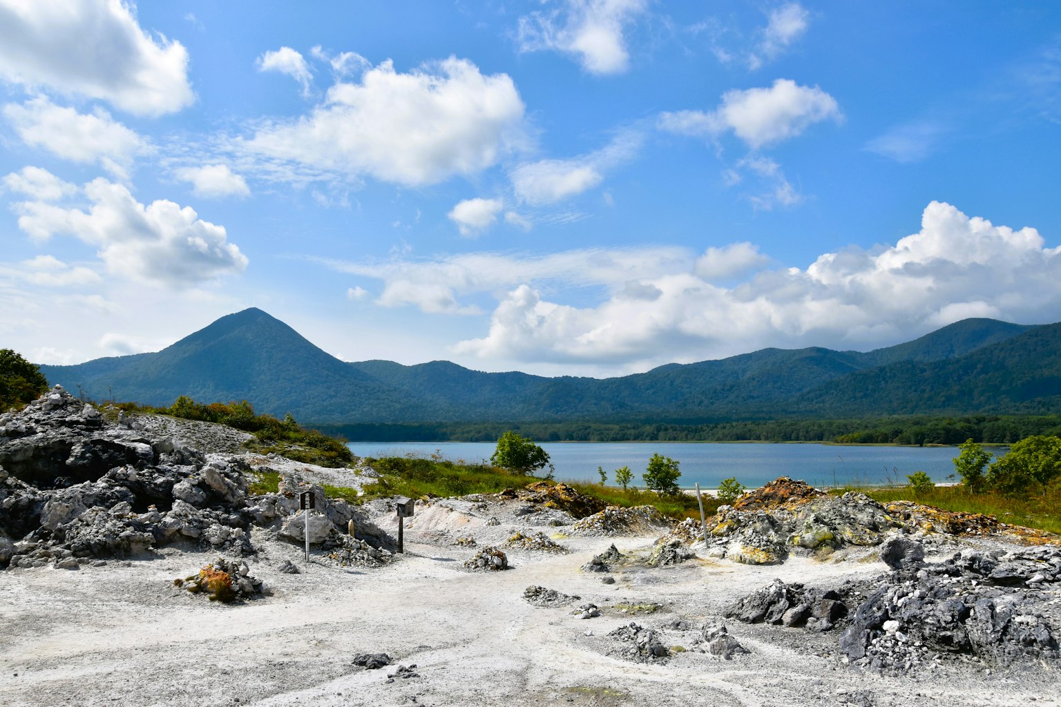 Scenic view of mountains and lake surrounded by rocky terrain