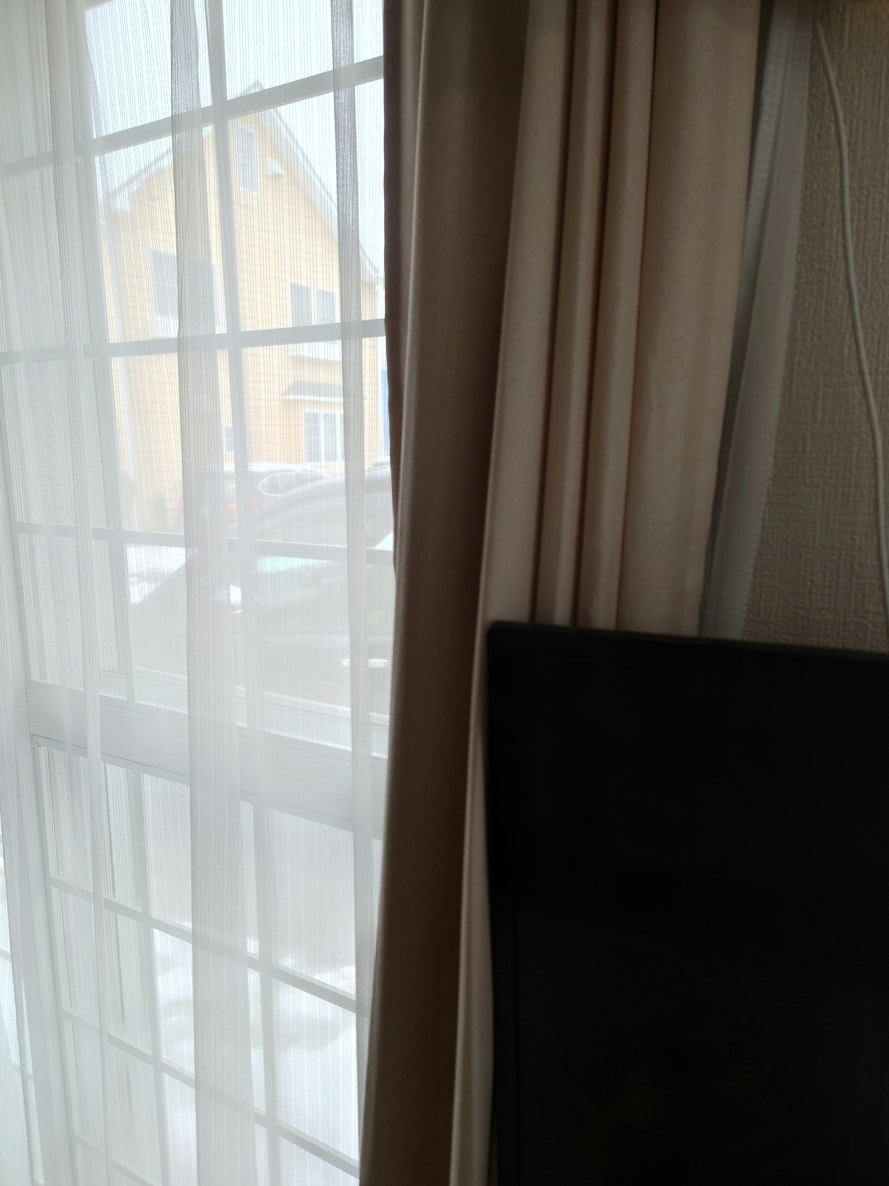 Curtains by a window with soft natural light in an interior