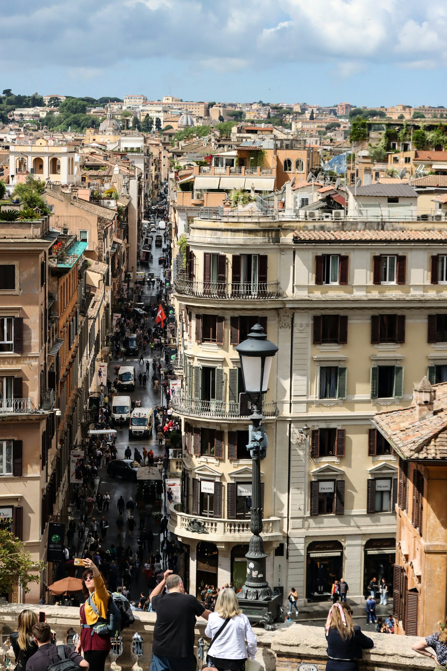 View of a bustling street in Rome with historic buildings