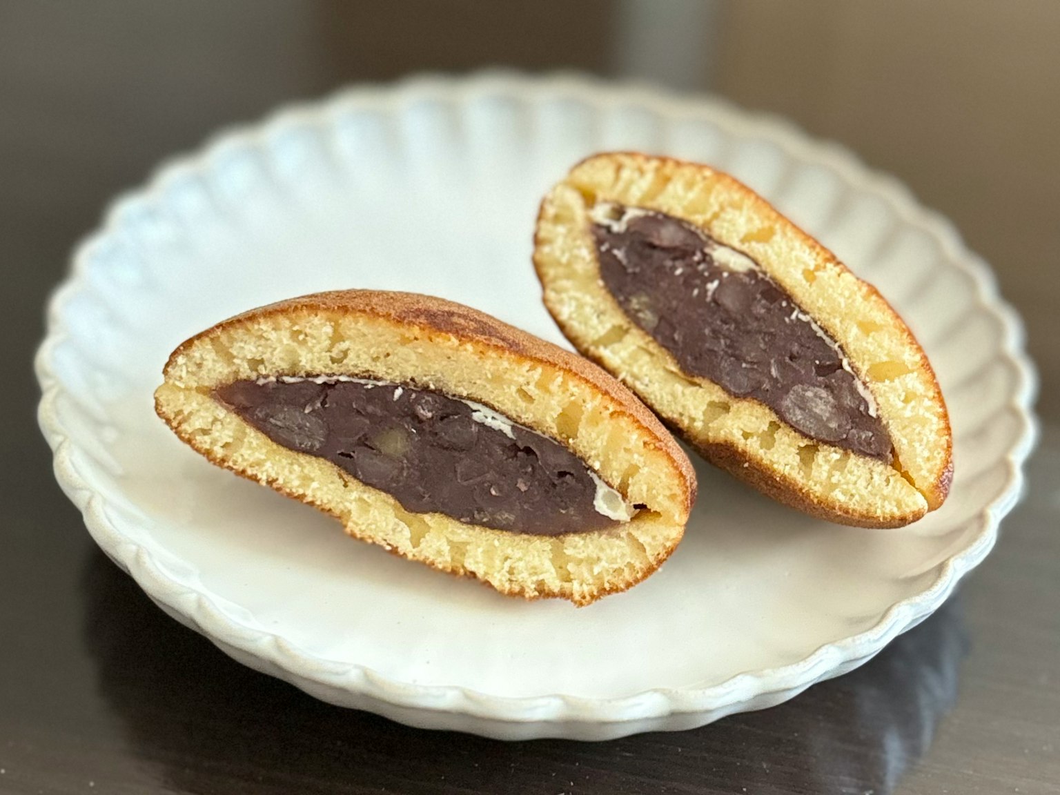 Cross-section of a sweet Japanese pastry filled with red bean paste